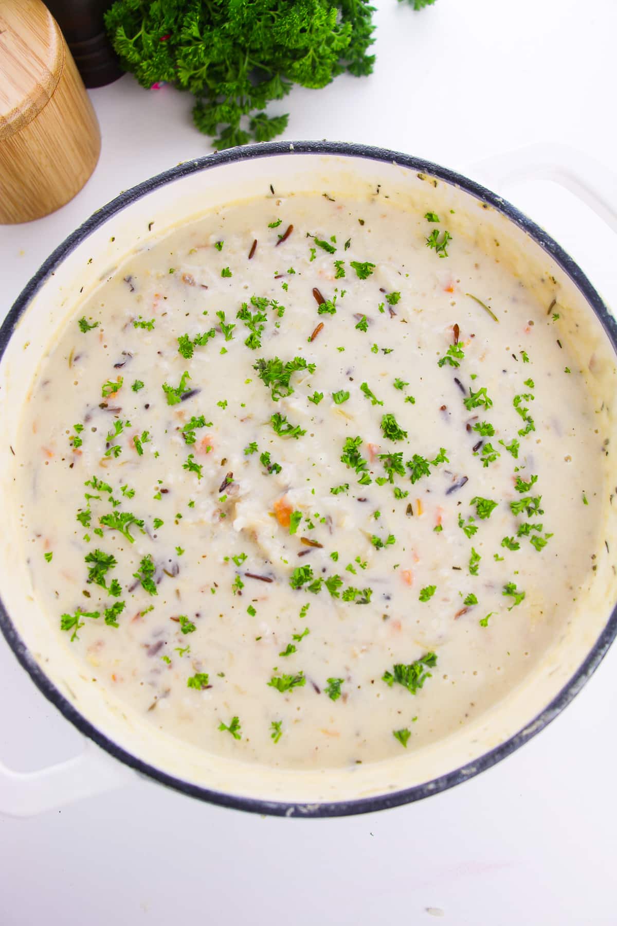 overhead image of wild rice soup in a Dutch oven