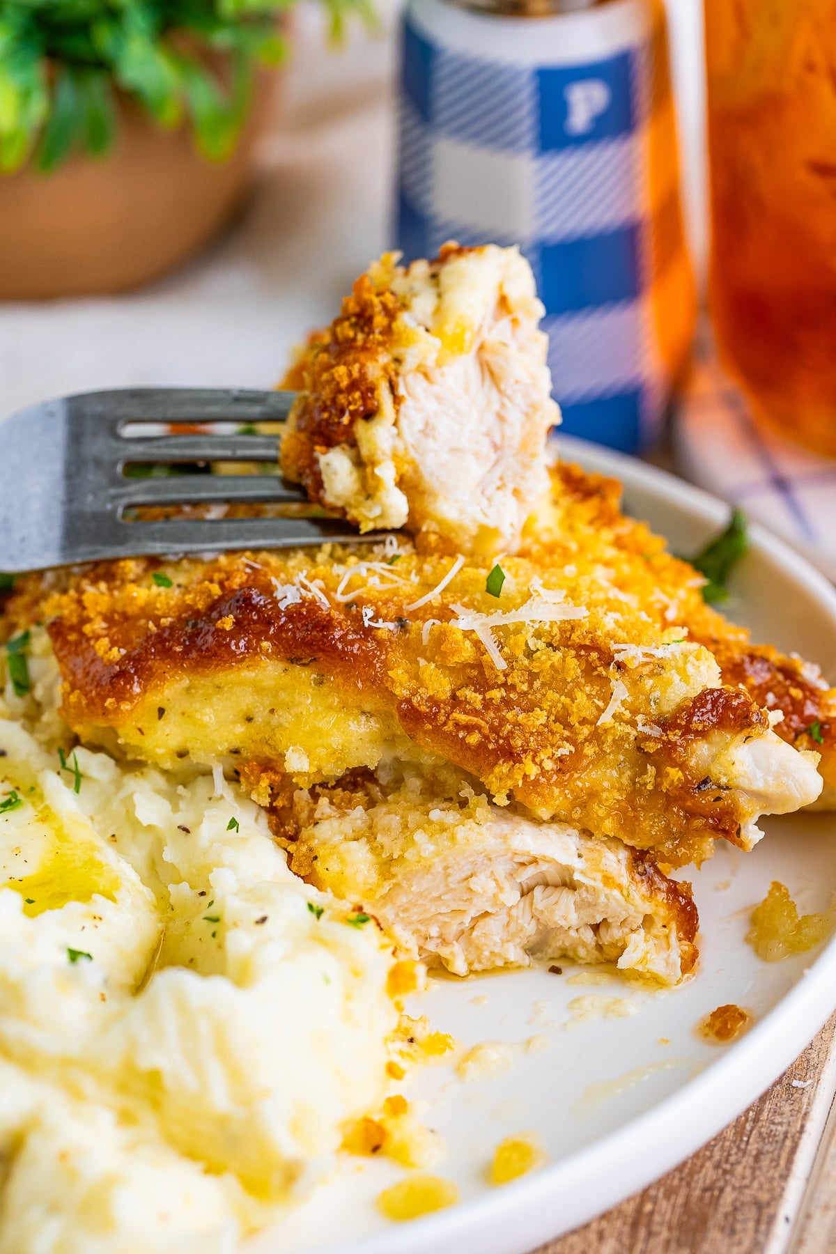Oven Baked Chicken Tenders on a plate, sliced in half to see the interior