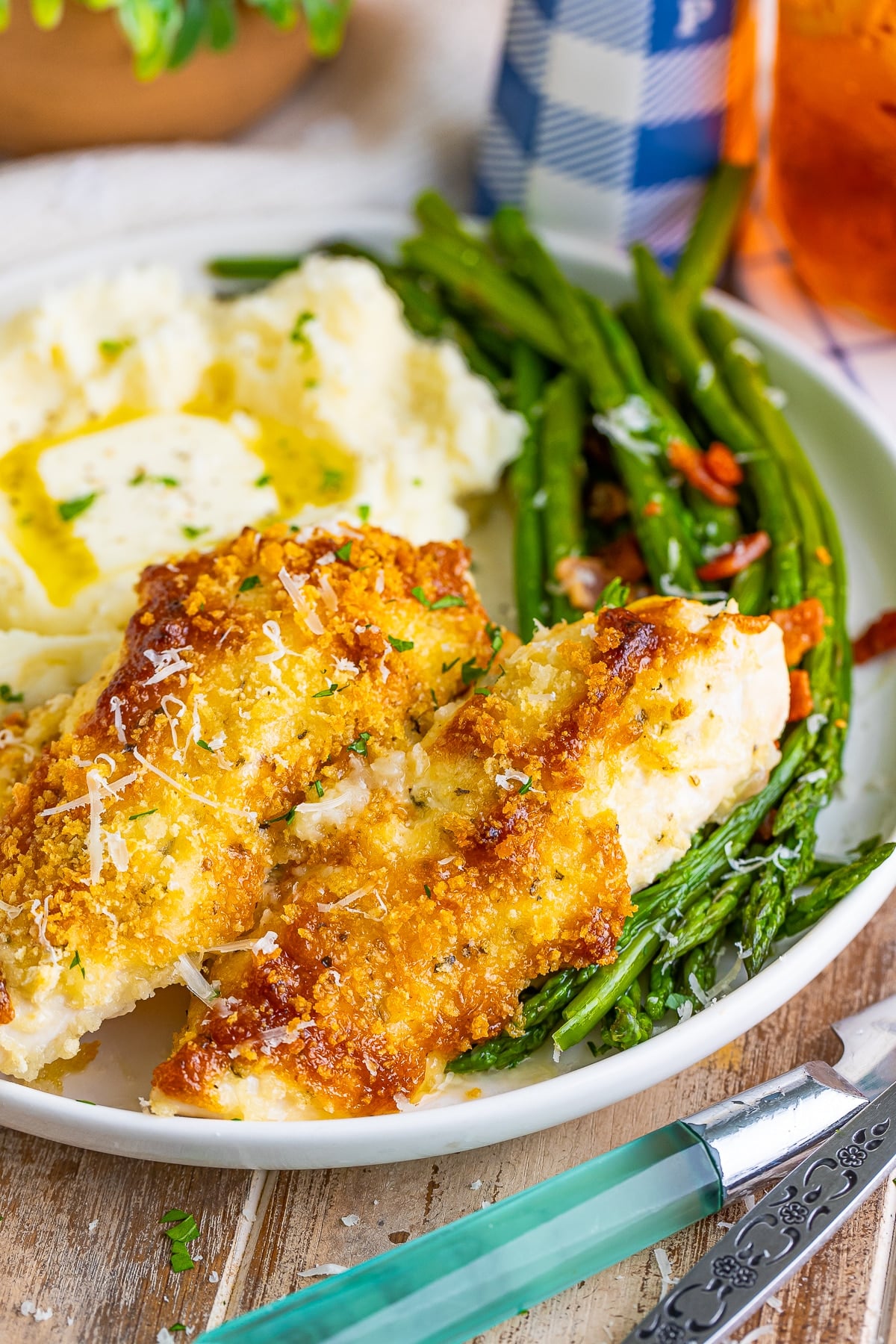 Oven Baked Chicken Tenders on a white plate sitting on a wooden table top