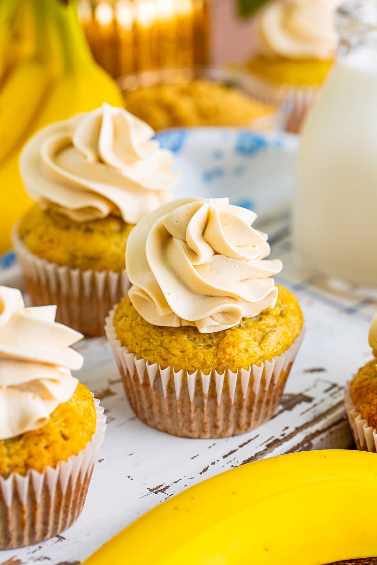 Banana Cupcakes on a white wooden serving board