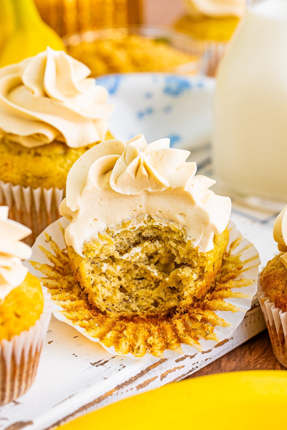 Banana Cupcakes on a serving board with a bite taken out