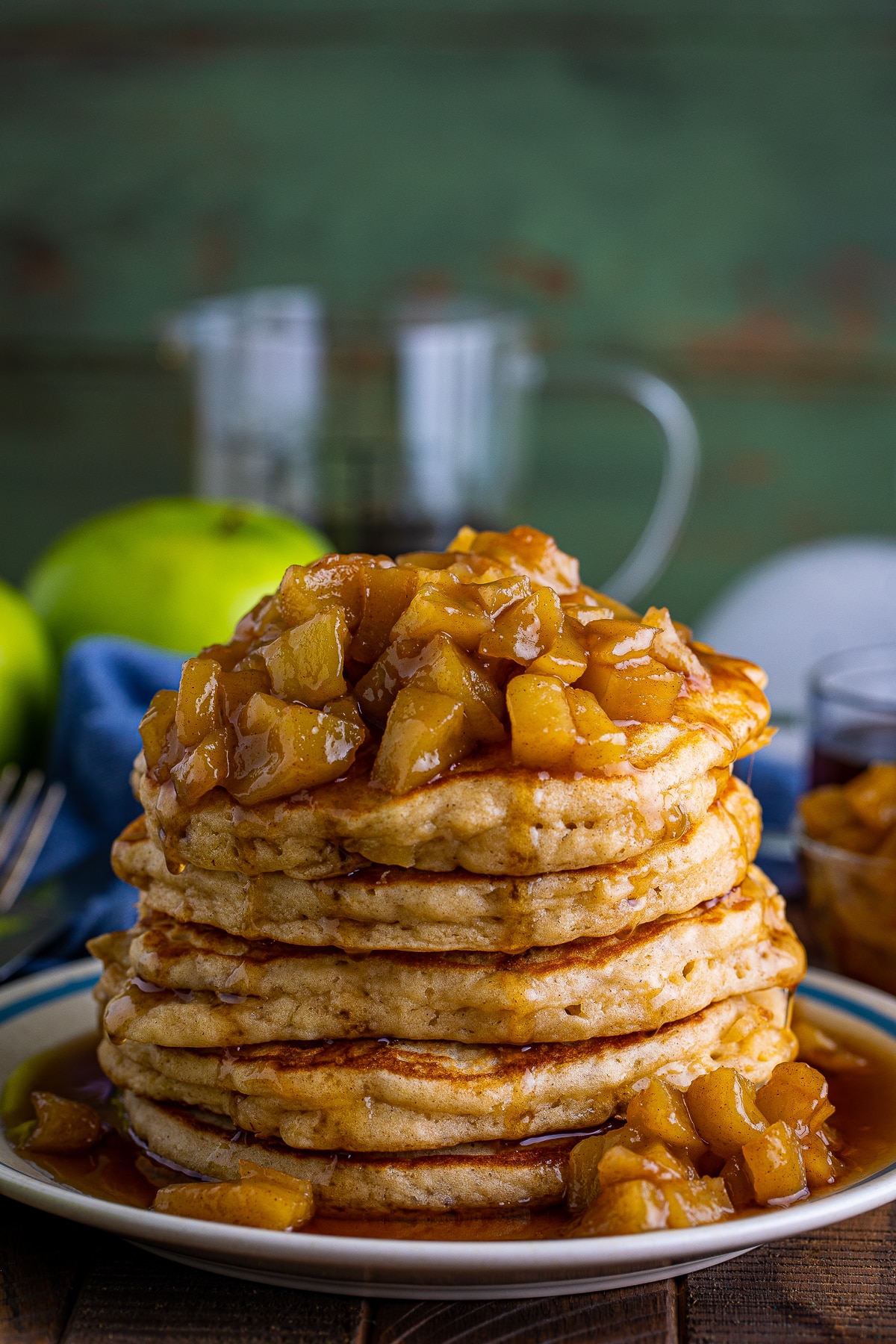 straigt on show of a stack of Apple Pancakes Recipe on a tane plate