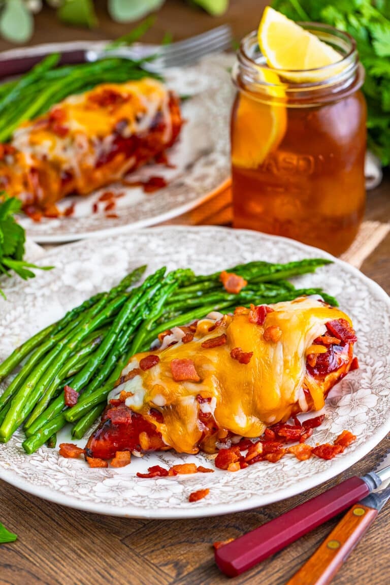 Copycat Chili's Monterey chicken topped with bacon and melted cheese on a plate.
