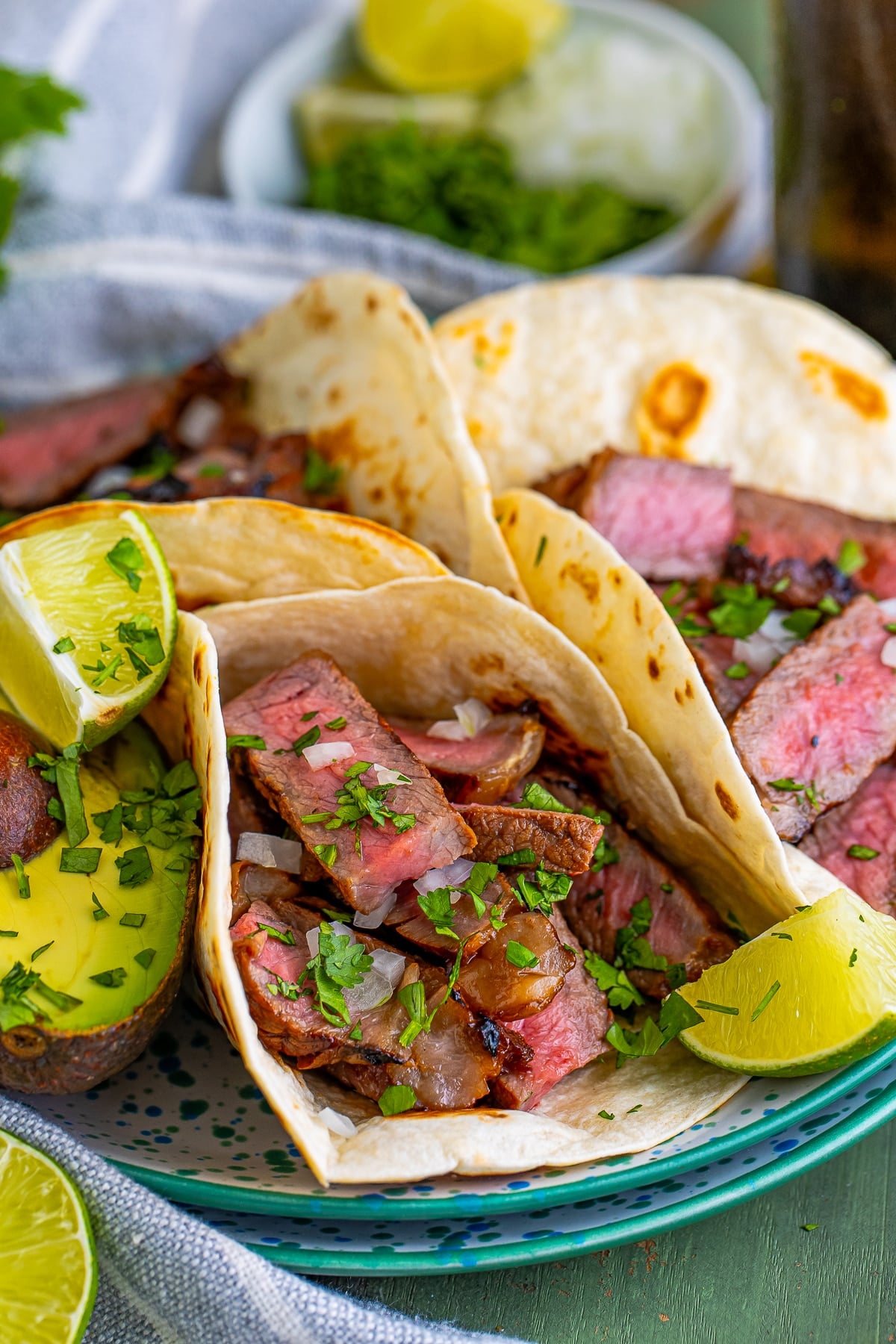 plated Carne Asada Tacos Recipe with lime and avocado