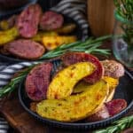A plate of crispy roasted fingerling potatoes with rosemary.