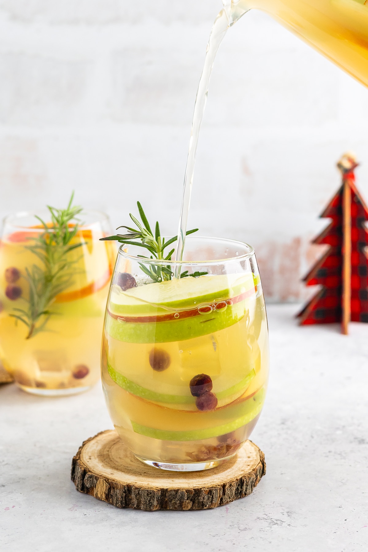 pouring Winter Sangria into glass