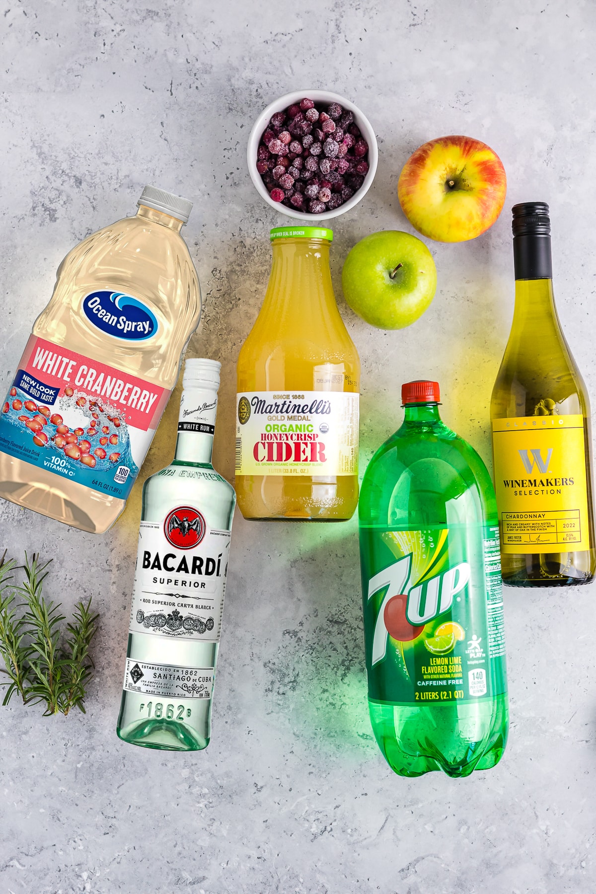 This white wine sangria is light, refreshing and effervescent, with flavors of vanilla, apples, and cranberries. #recipe from thissillygirlskitchen.com #sangria #whitewinesangria #wintersangria #holidaysangria #cranberry #apple #cocktail ingredients needed to make Winter Sangria
