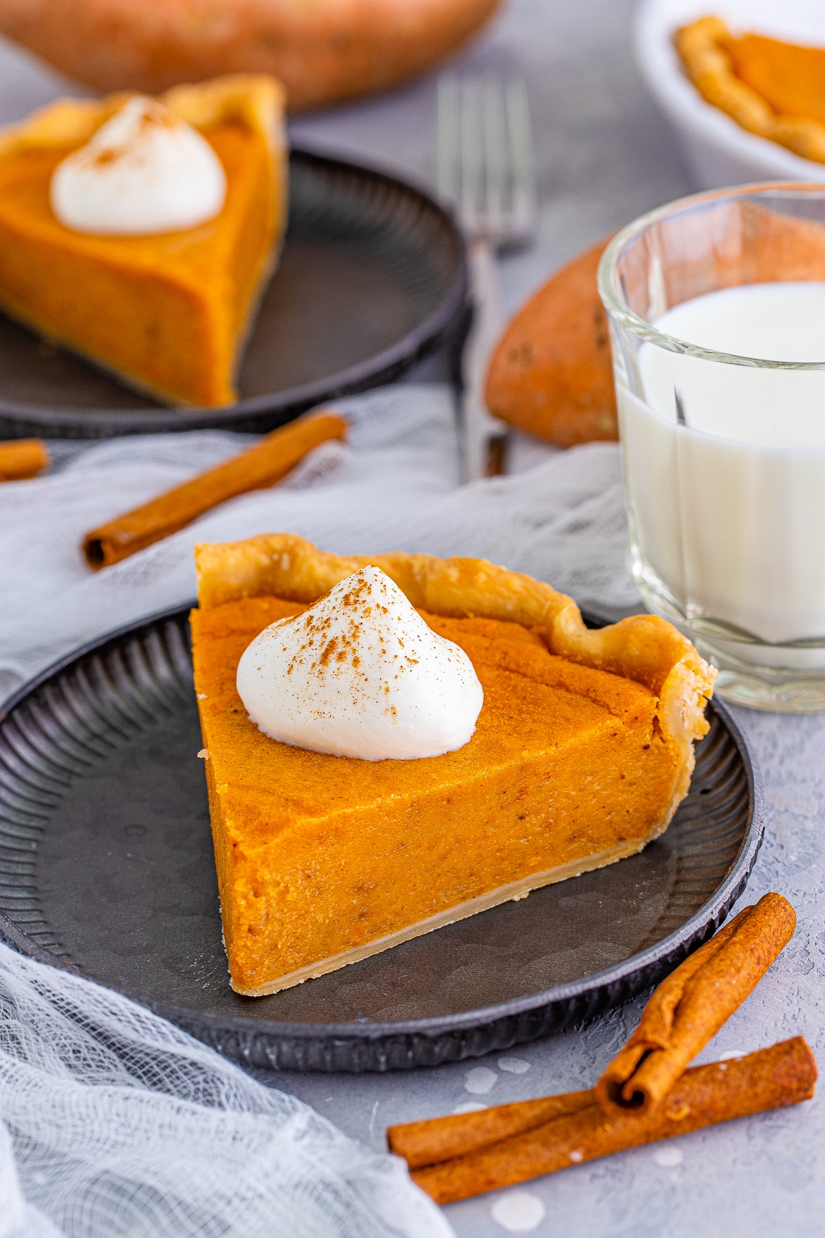 slices of Sweet Potato Pie on metal plates