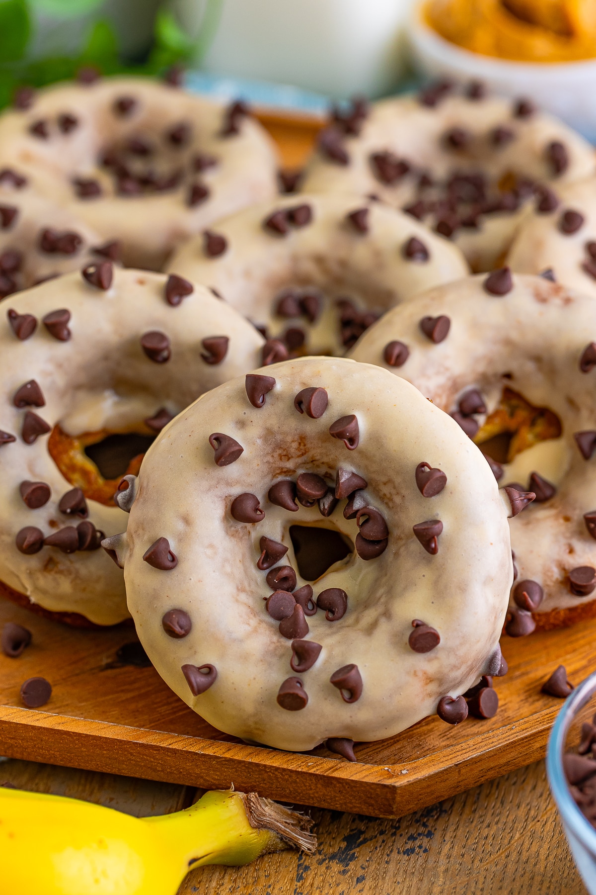 up close image of Banana Donuts on tray with chocolate chips