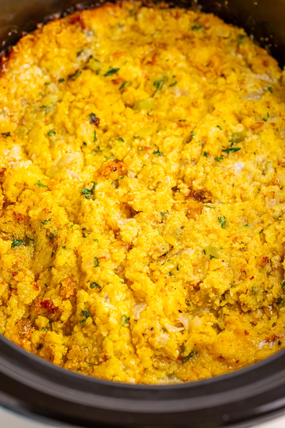 close up image of Cornbread Dressing in the slow cooker