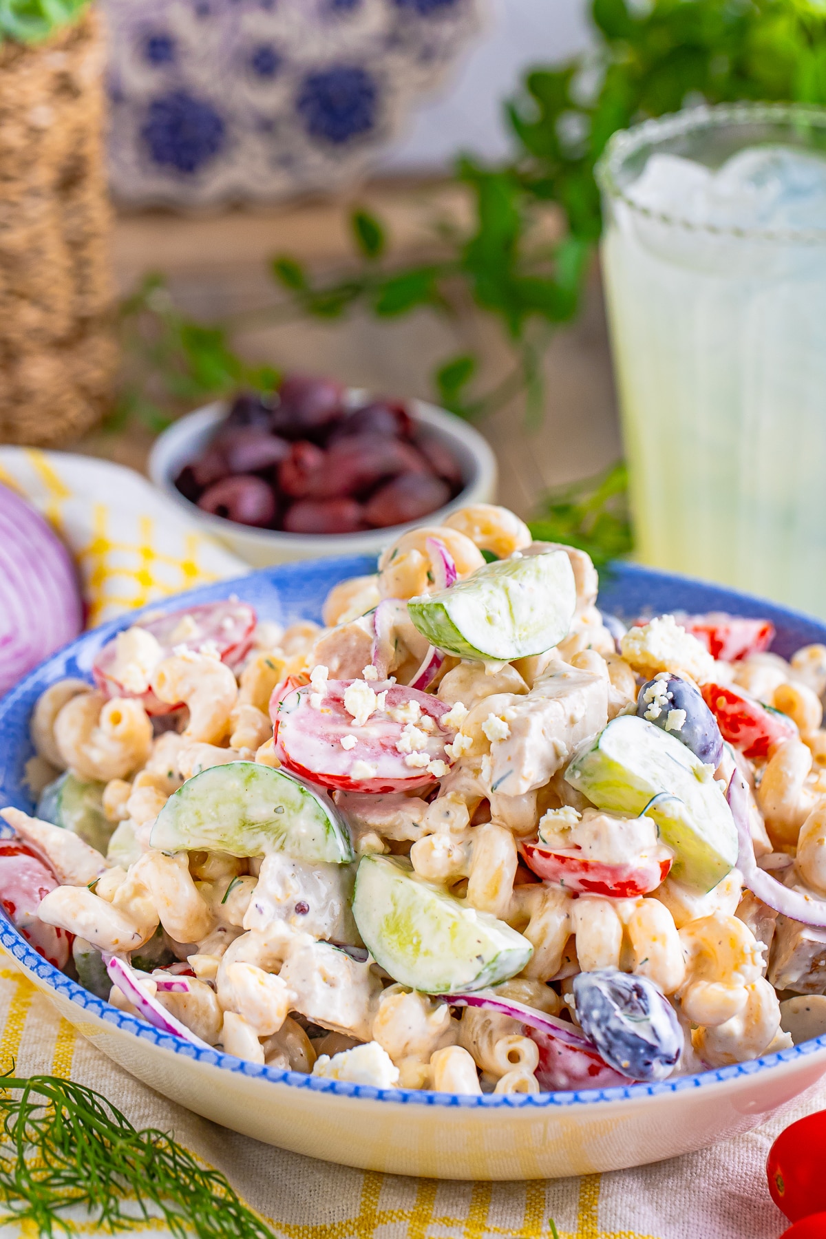 finished Greek Pasta Salad Recipe in a bowl with garnishes