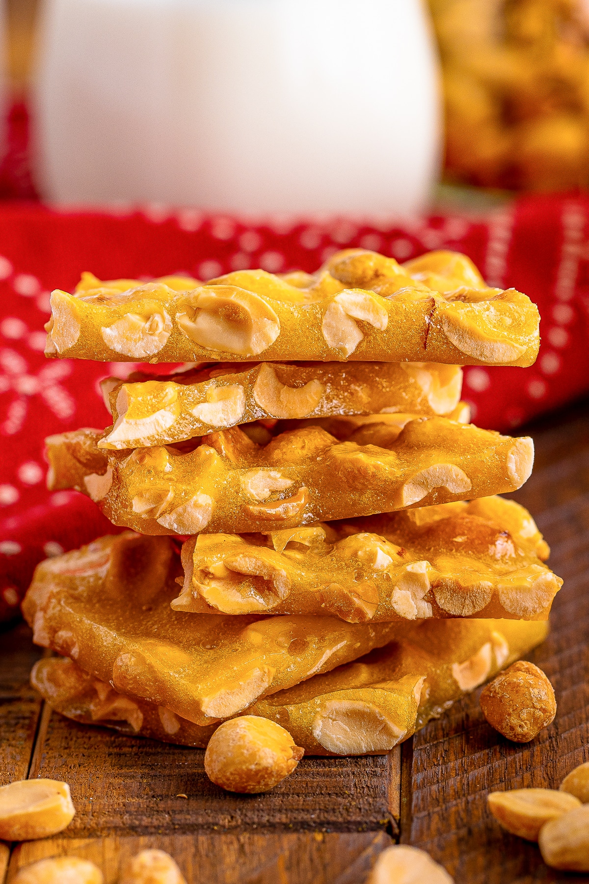 a stack of Microwave Peanut Brittle on a wooden table top