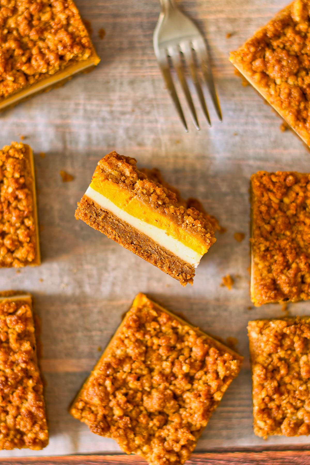 overhead image of Pumpkin Cheesecake Bars one of them turned on its side