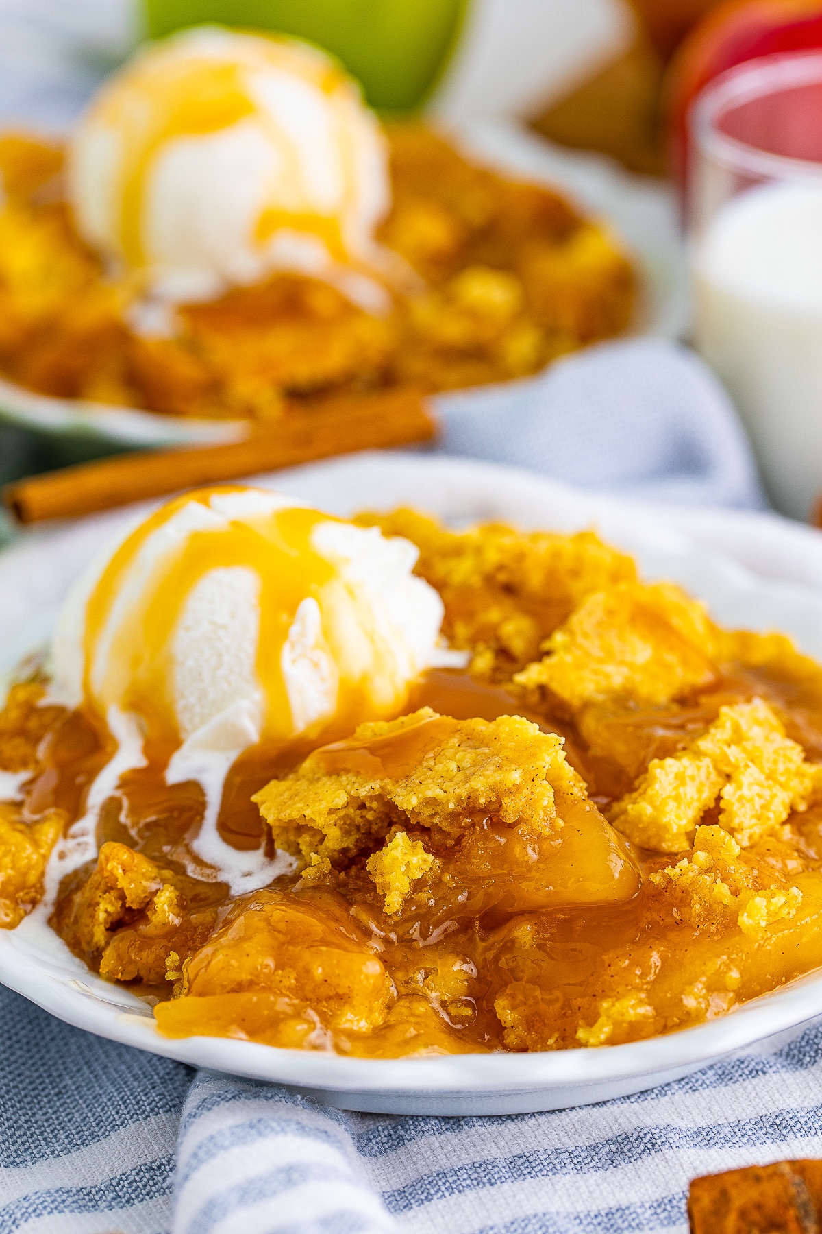up close image Caramel Apple Dump Cake on white plate 