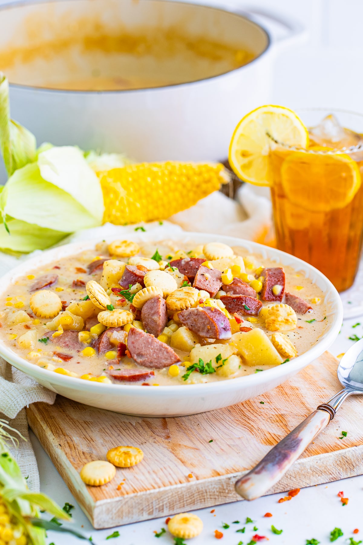 Corn Chowder recipe served in a white bow l with garnishes