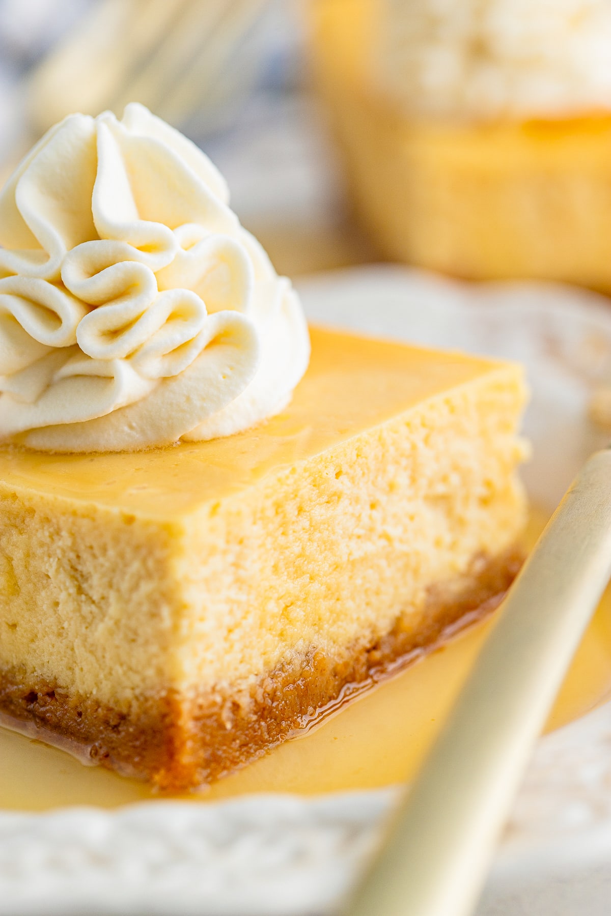 up close image of a slice of Maple Cheesecake on a white plate