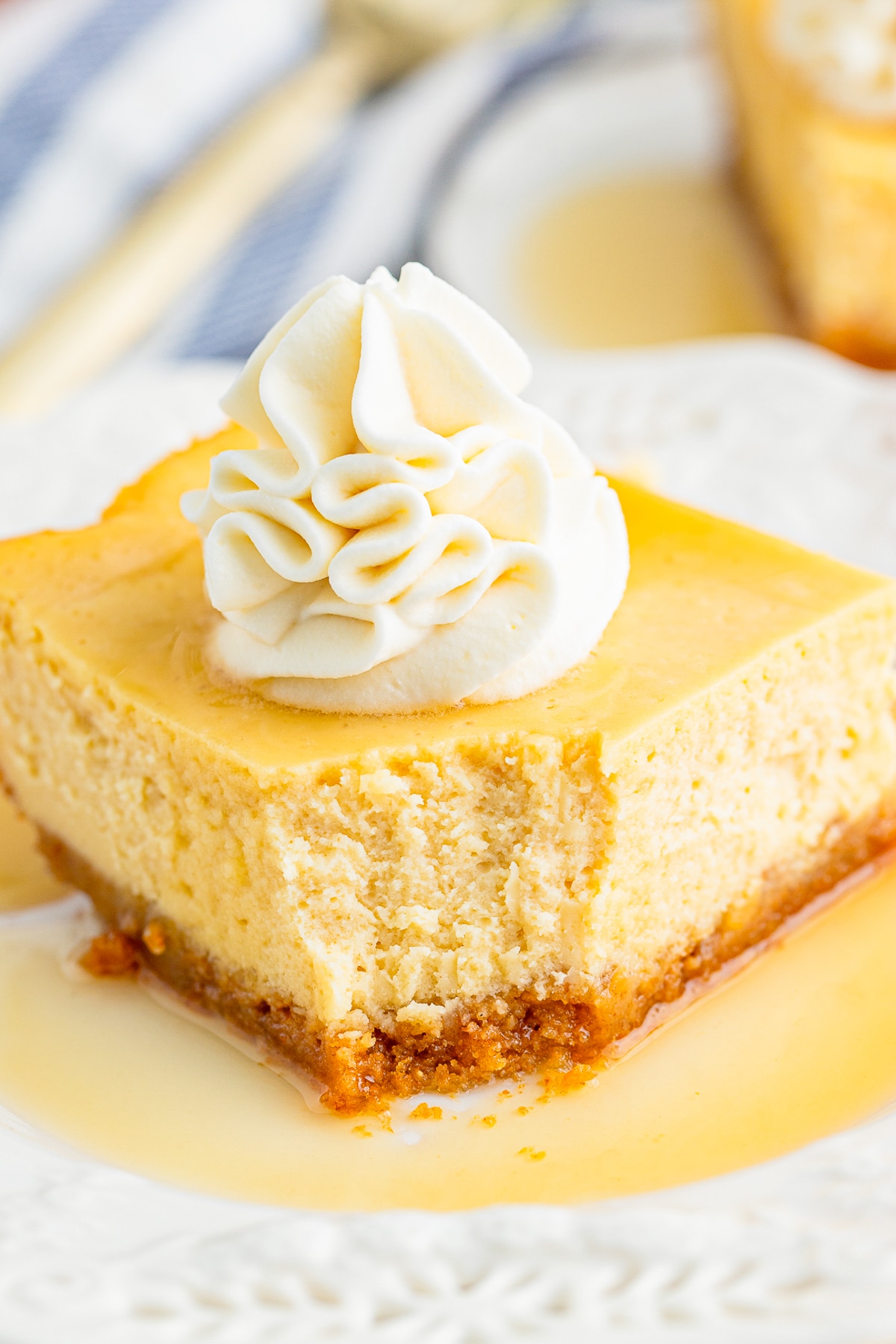 a piece of Maple Cheesecake on a white plate with a bite taken out 