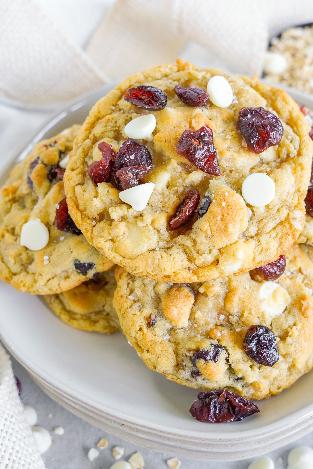 White Chocolate Cranberry Cookies on a white plate, overhead image