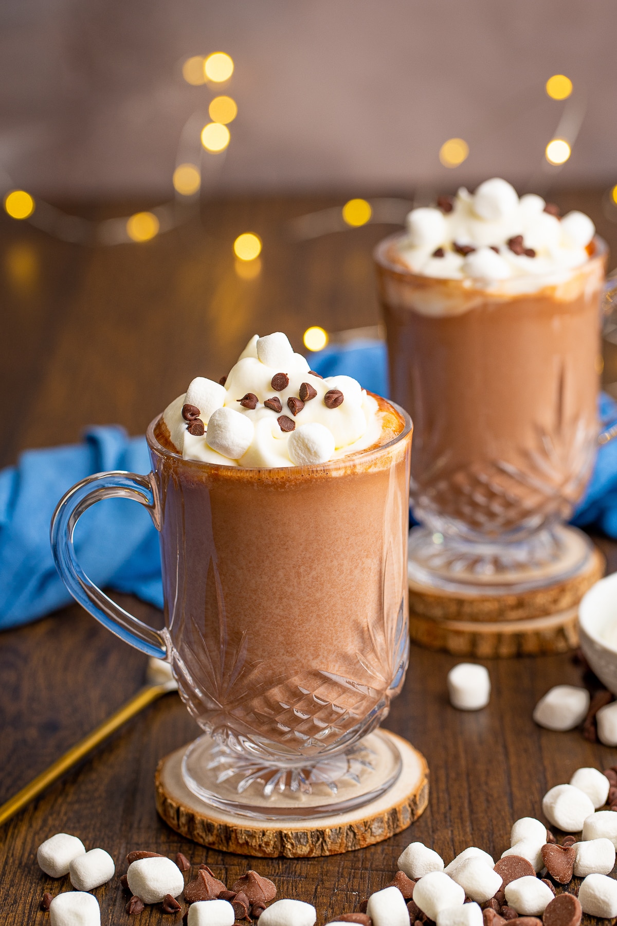two glasses of Boozy hot chocolate  on a wooden table top