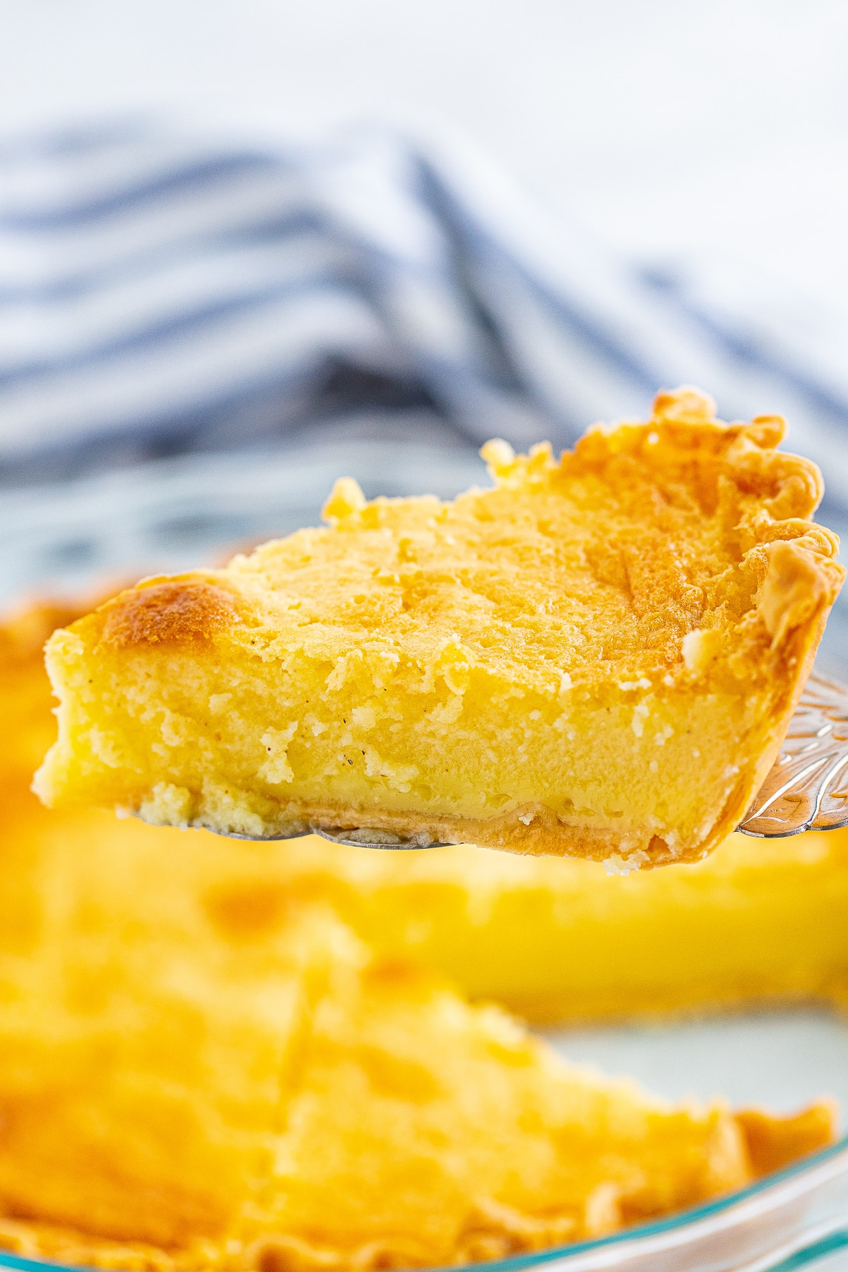 a slice of Buttermilk Pie in air on a cake server