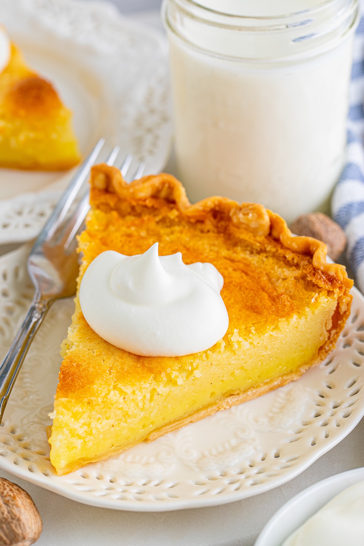 a slice of Buttermilk Pie on a white plate