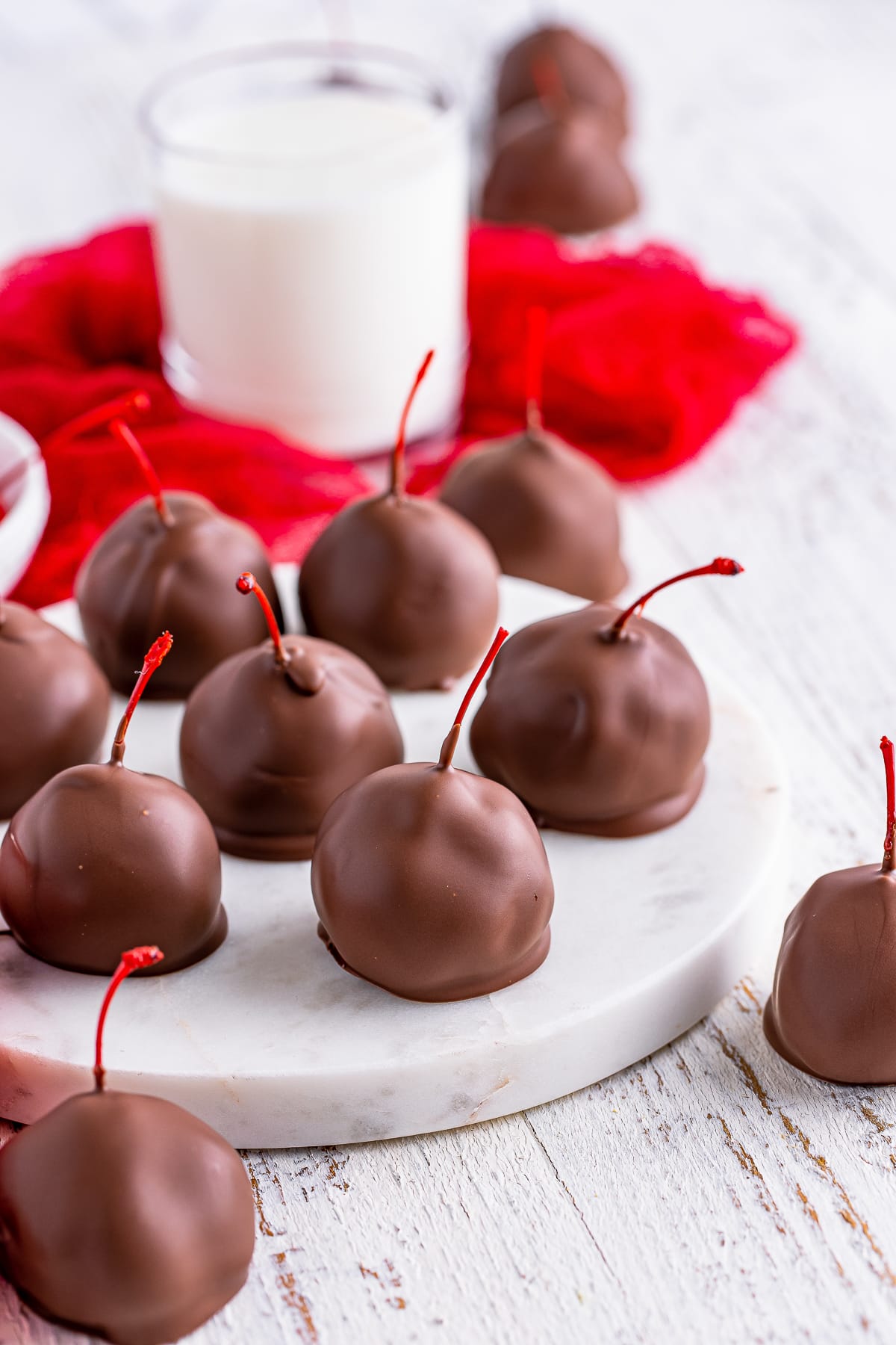 Brownie Truffles served on a white marble slab, one cut in half to show interior