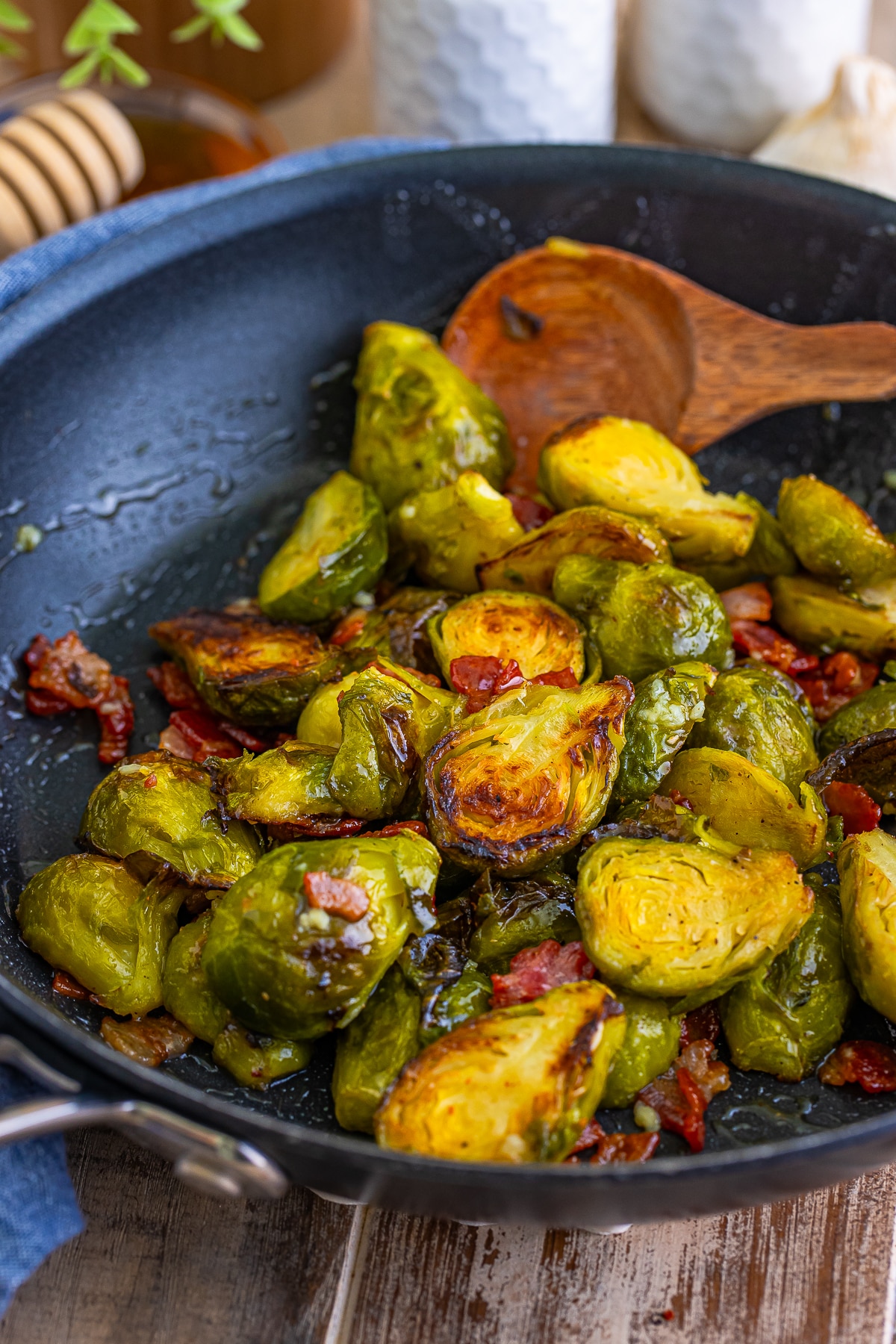 Brussel Sprouts with Bacon in the skillet with spoon