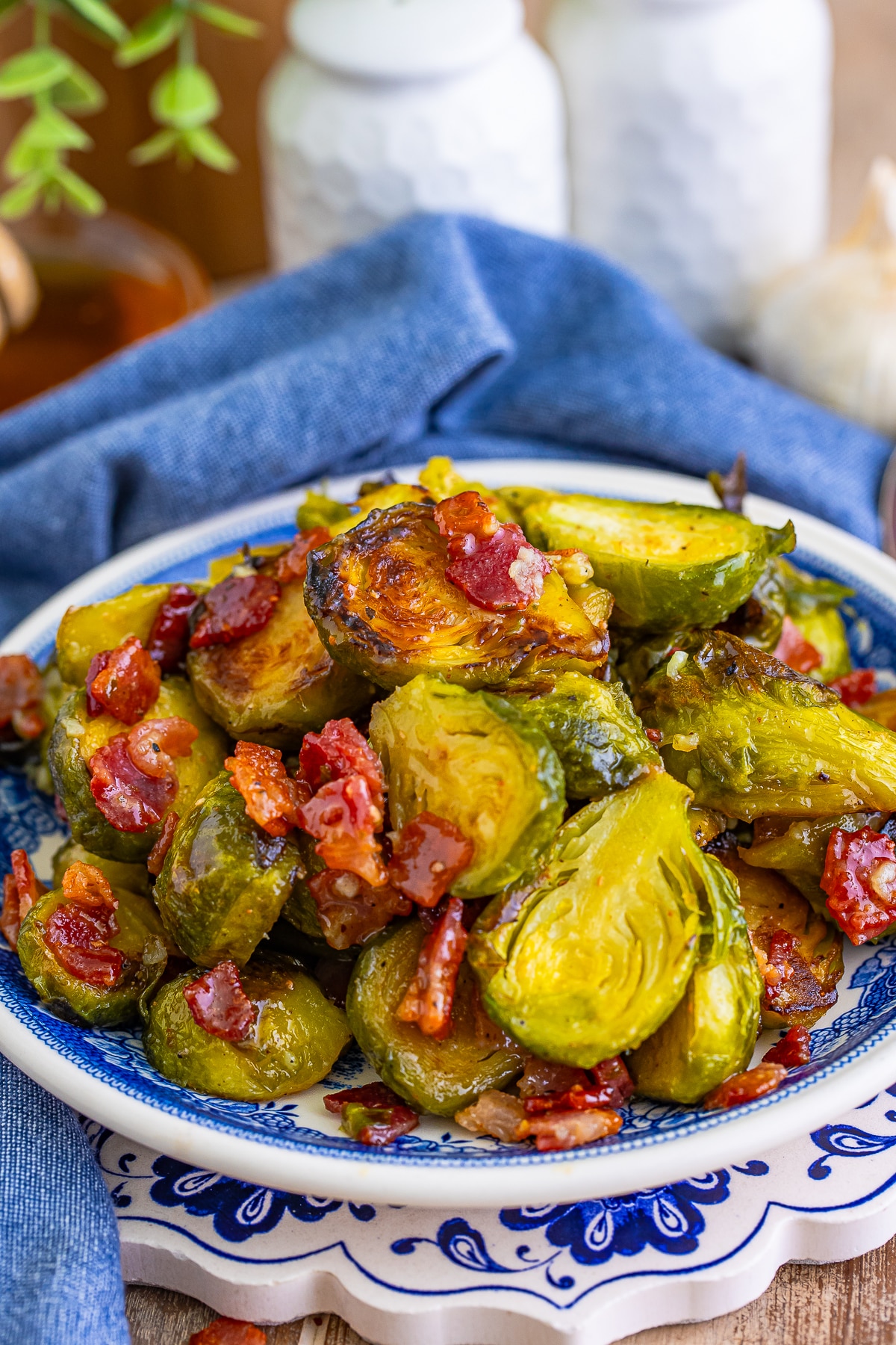 Brussel Sprouts with Bacon on blue serving plate