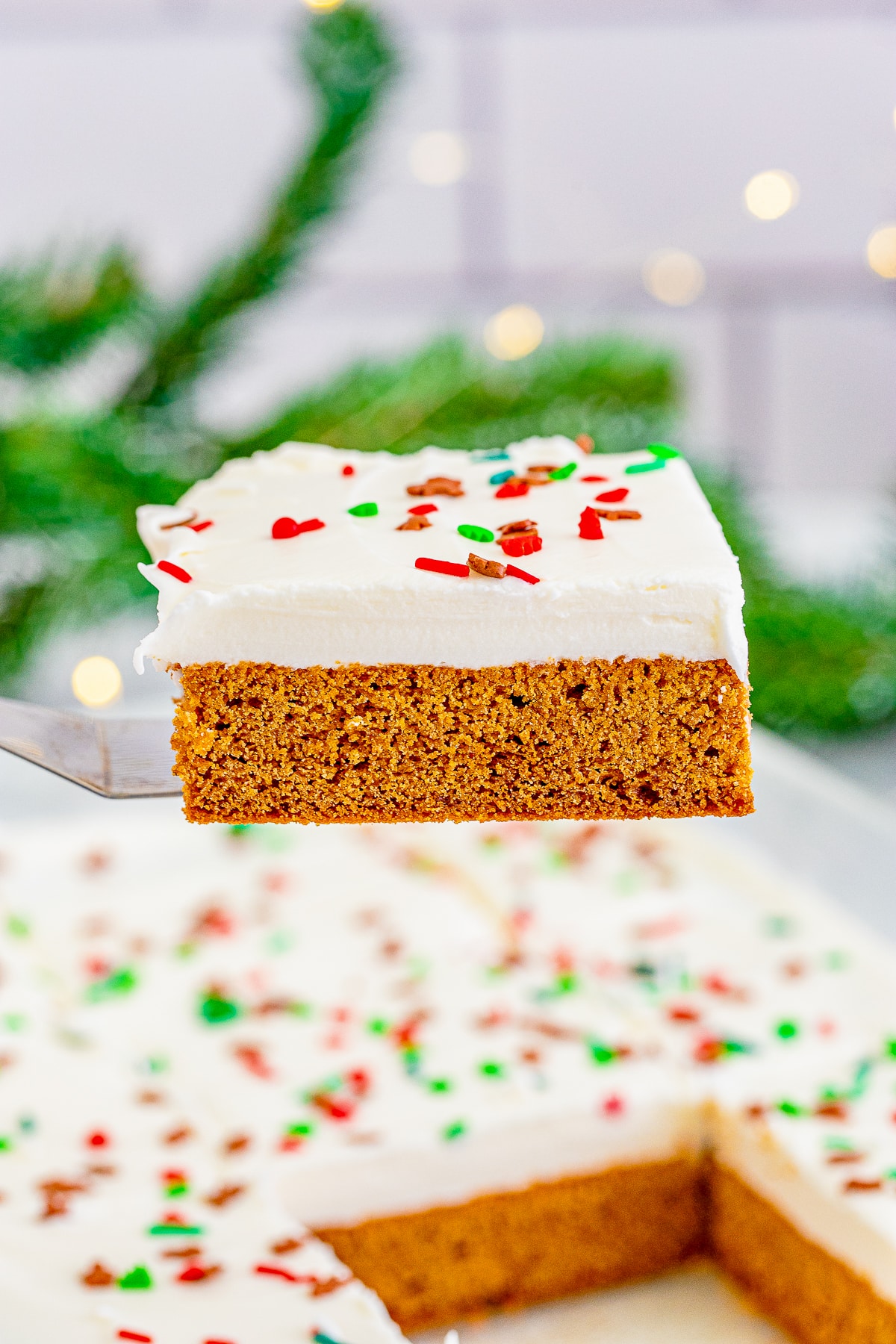 a spatula holding up Gingerbread Bars in air