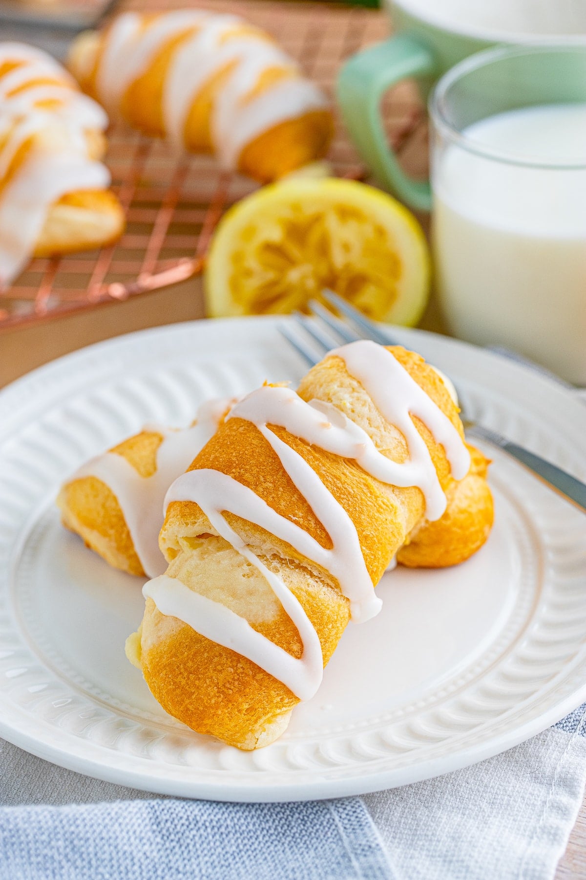 farther away image of Lemon Cheesecake Crescent Rolls on white plate