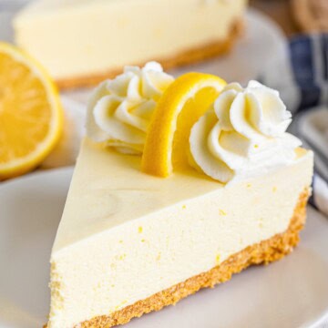 A slice of no-bake lemon pie on a white plate.
