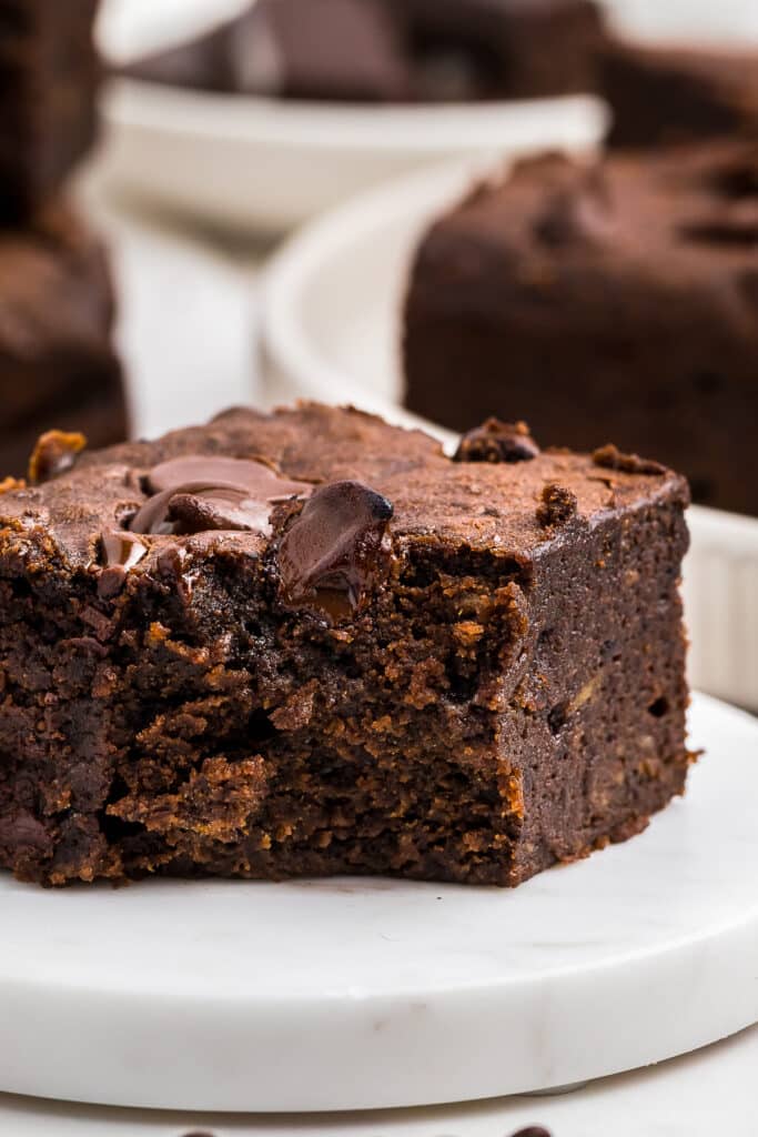 up close image Sweet Potato Brownies on a marble slab with a bite taken out