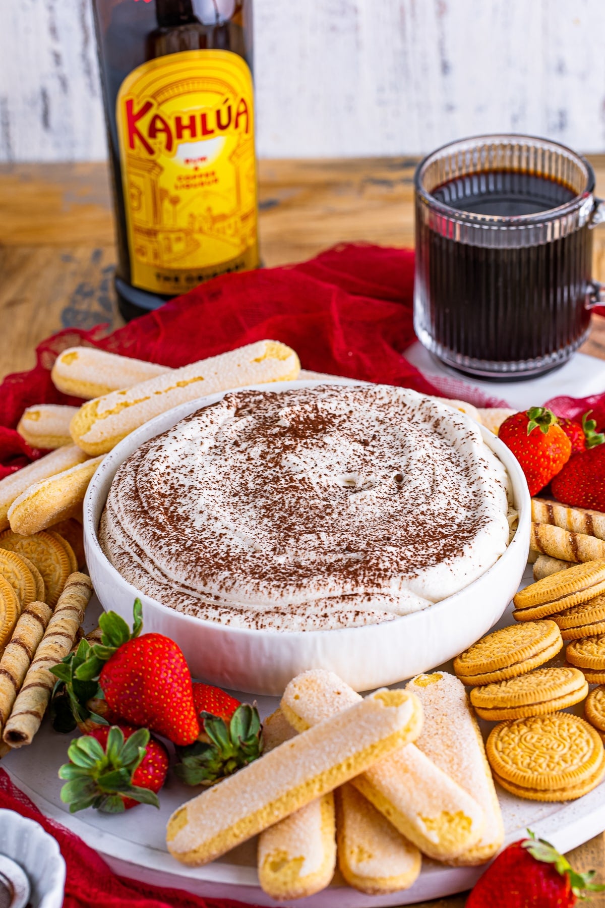 farther away image of Tiramisu Dip served with cookies and strawberries