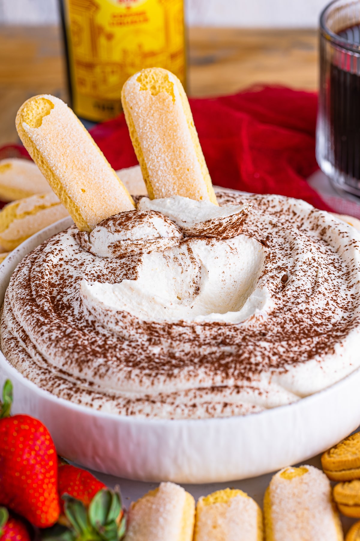 Tiramisu Dip in a bowl, some of the dip has been scooped out