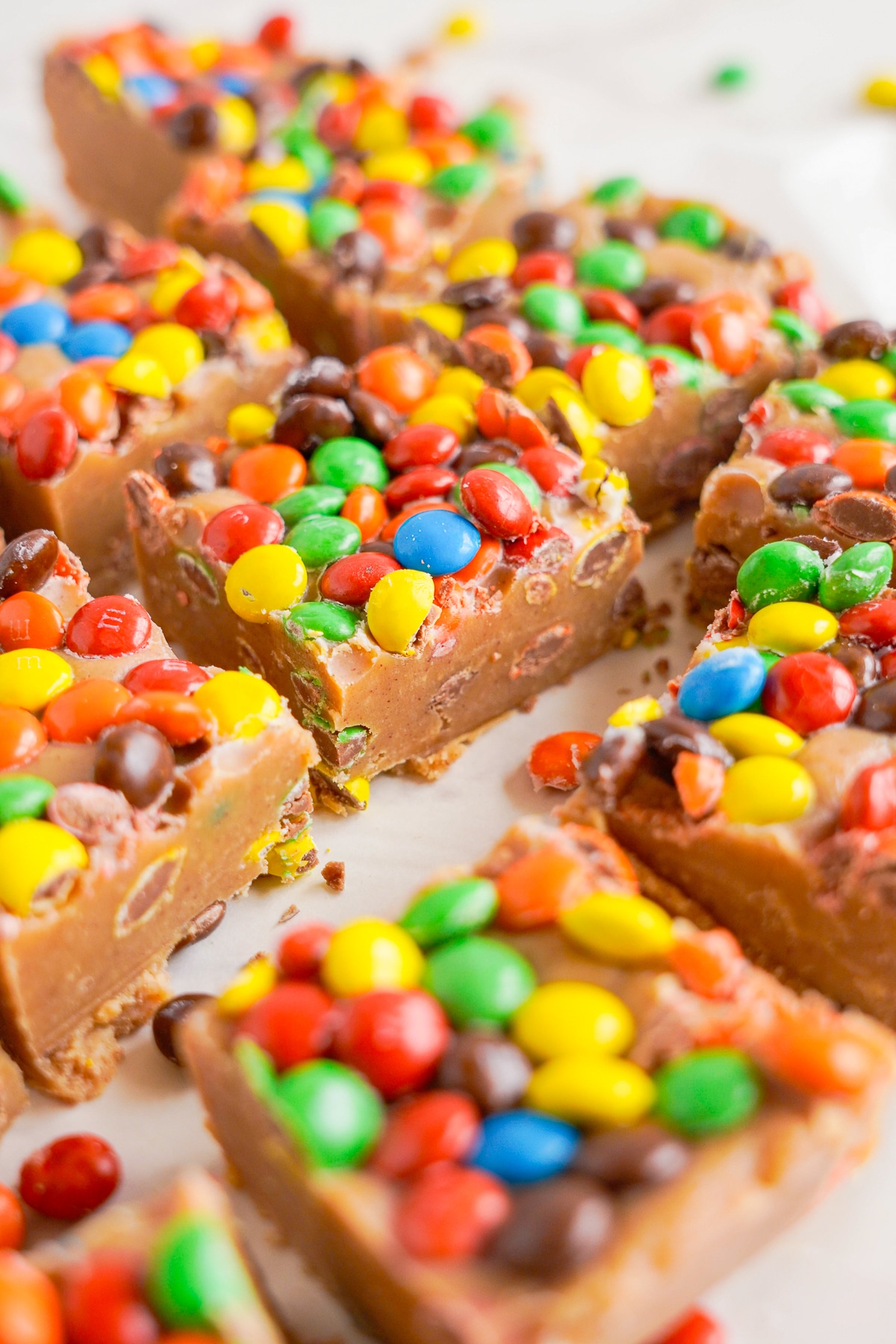 Peanut Butter Fudge cut into squares on parchment paper