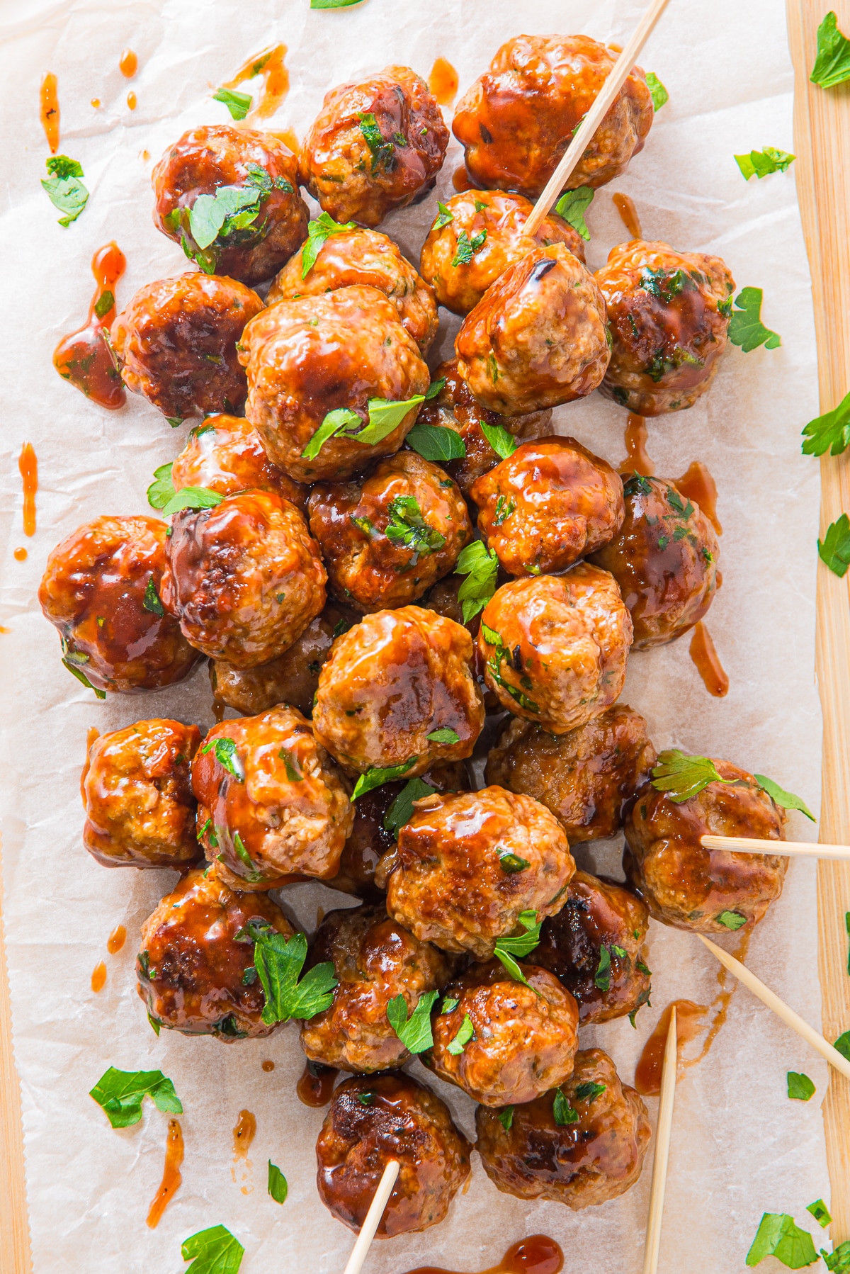 overhead image of BBQ meatballs on parchment paper
