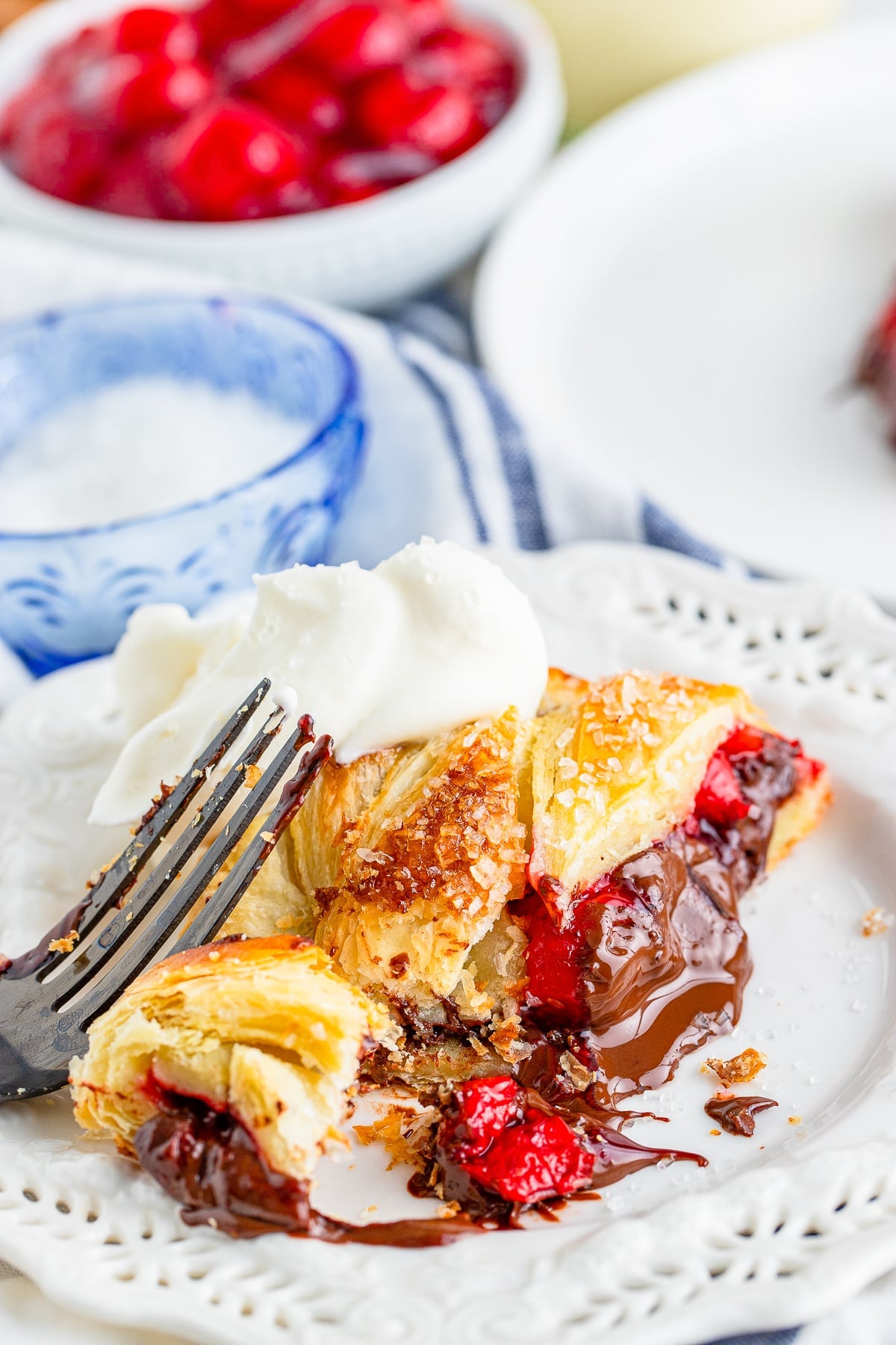 a piece of Pastry Braid on a white plate with a bite cut off