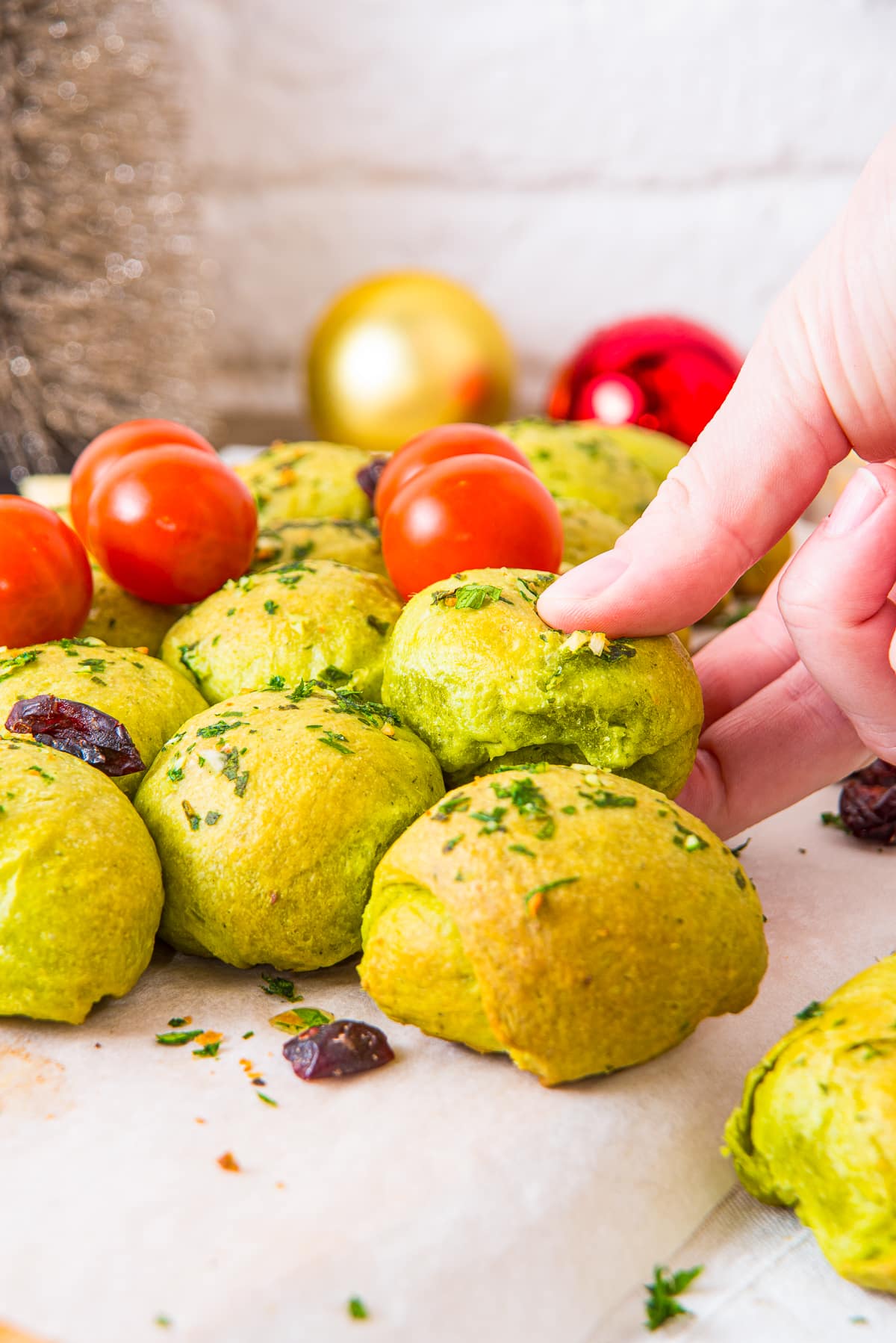 a hand pulling out a piece of Christmas Tree Pull Apart Bread
