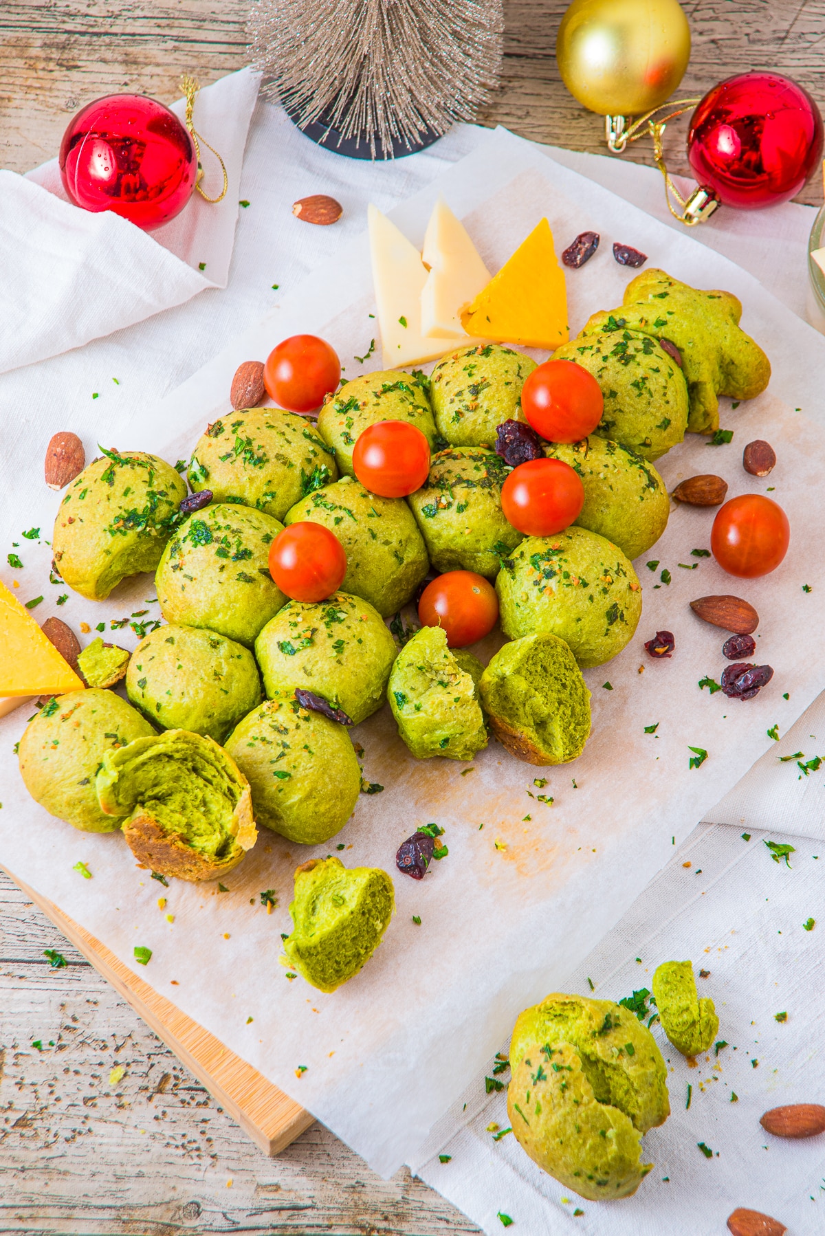Christmas Tree Pull Apart Bread on parchment paper with bites taken out