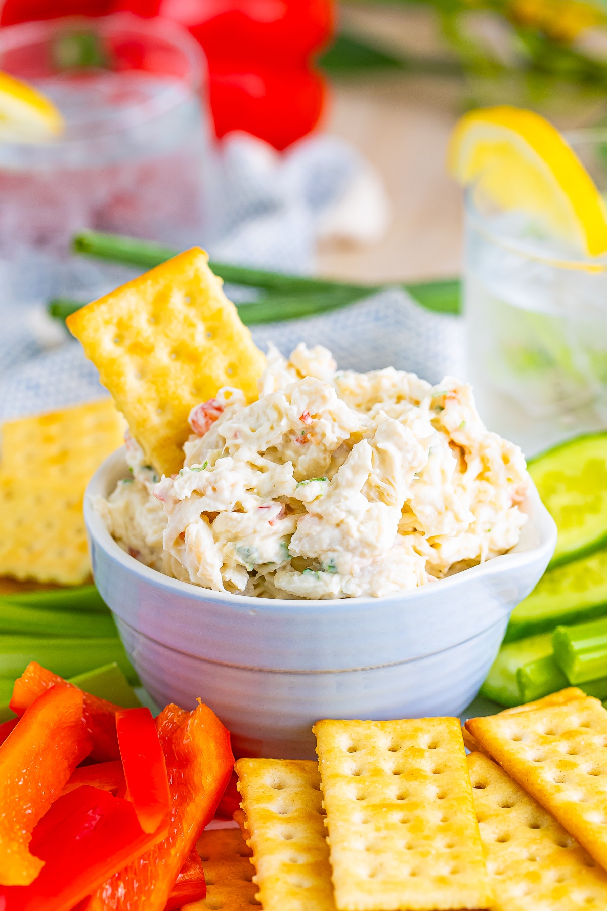 Cold Crab Dip in a serving dish with a cracker sticking out