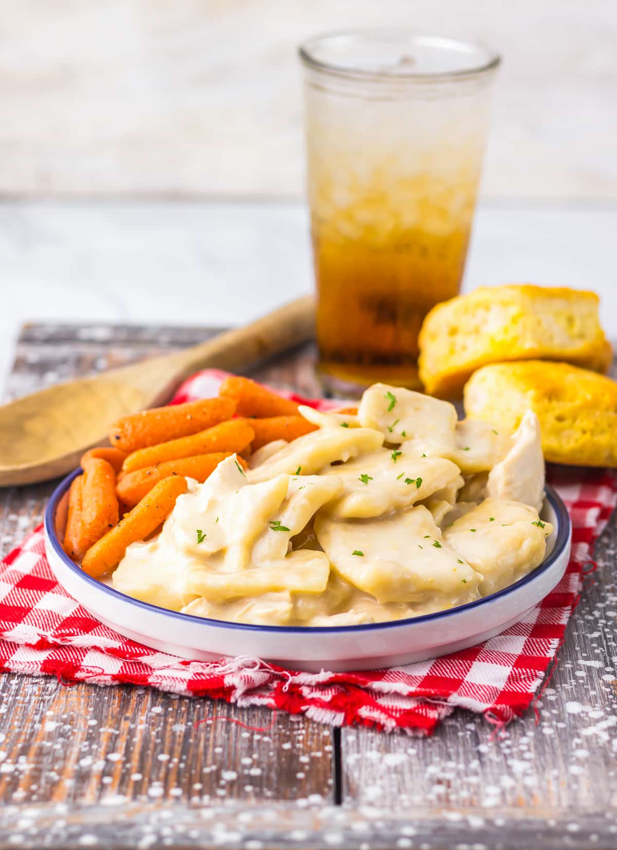 Cracker Barrel Chicken Dumplings served on a white plate with carrots