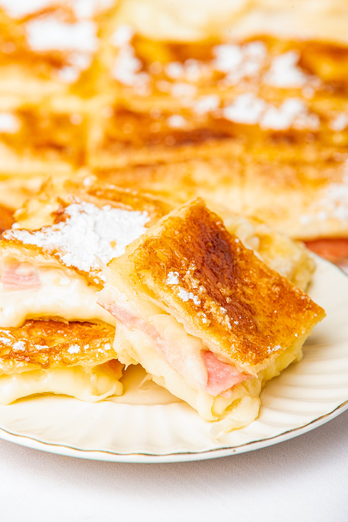 pieces of Ham Squares on a white plate