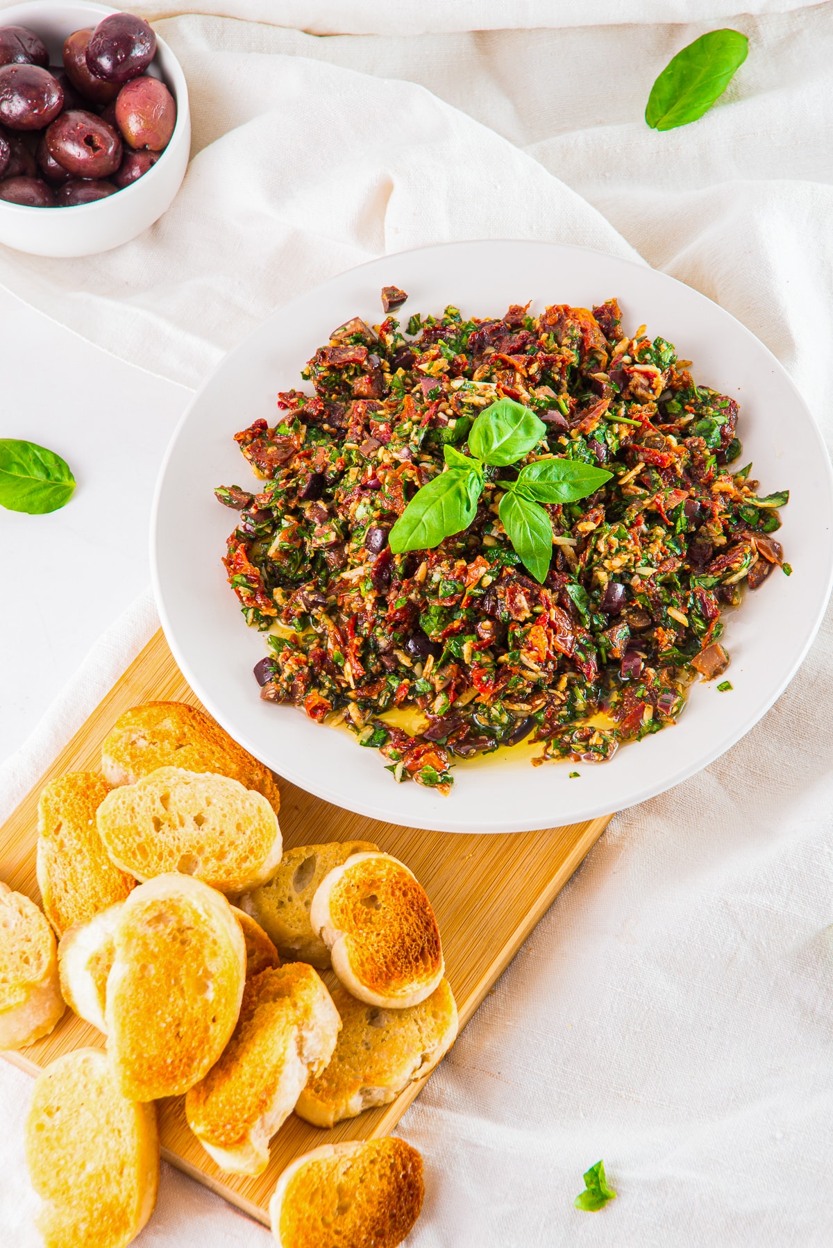 Mediterranean Dip served on a platter with crostini