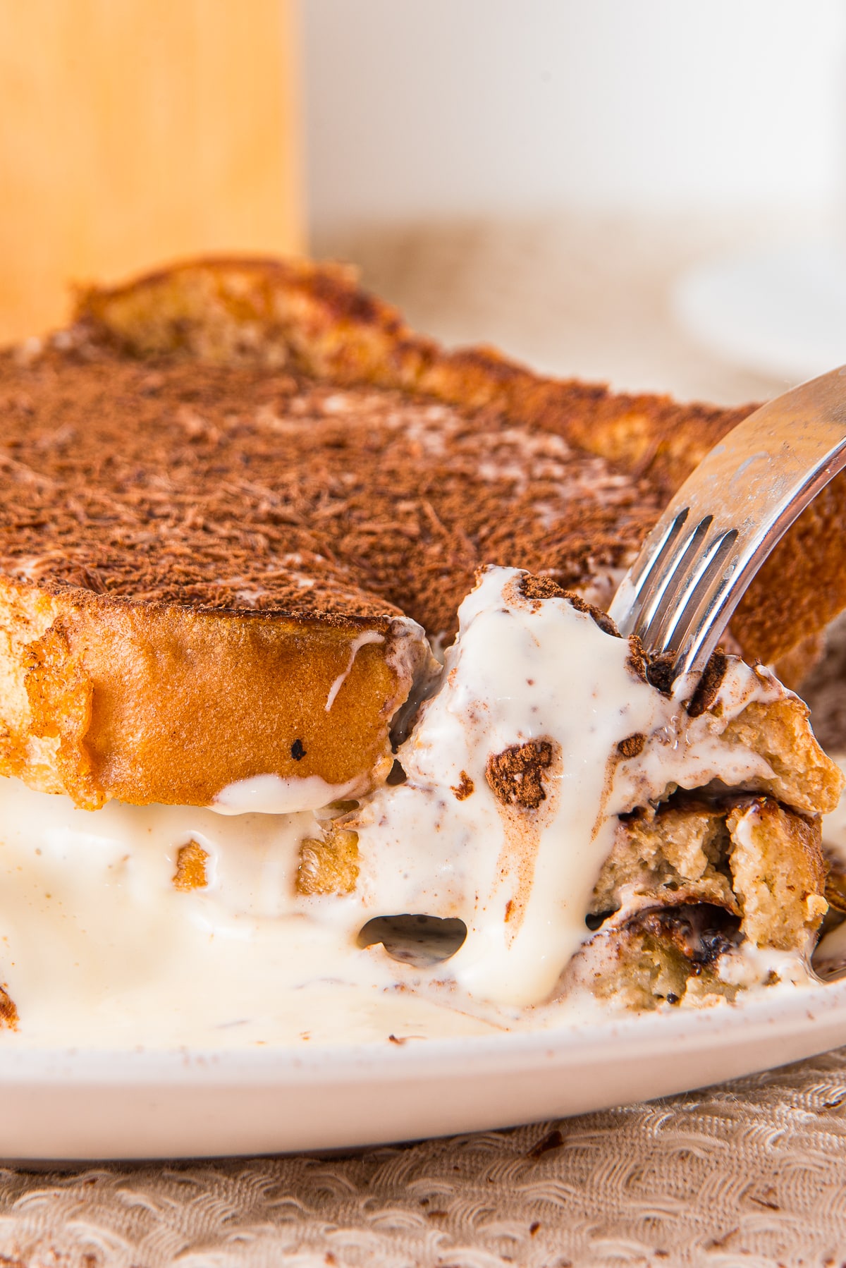 a fork grabbing a bite of Tiramisu French Toast off the plate