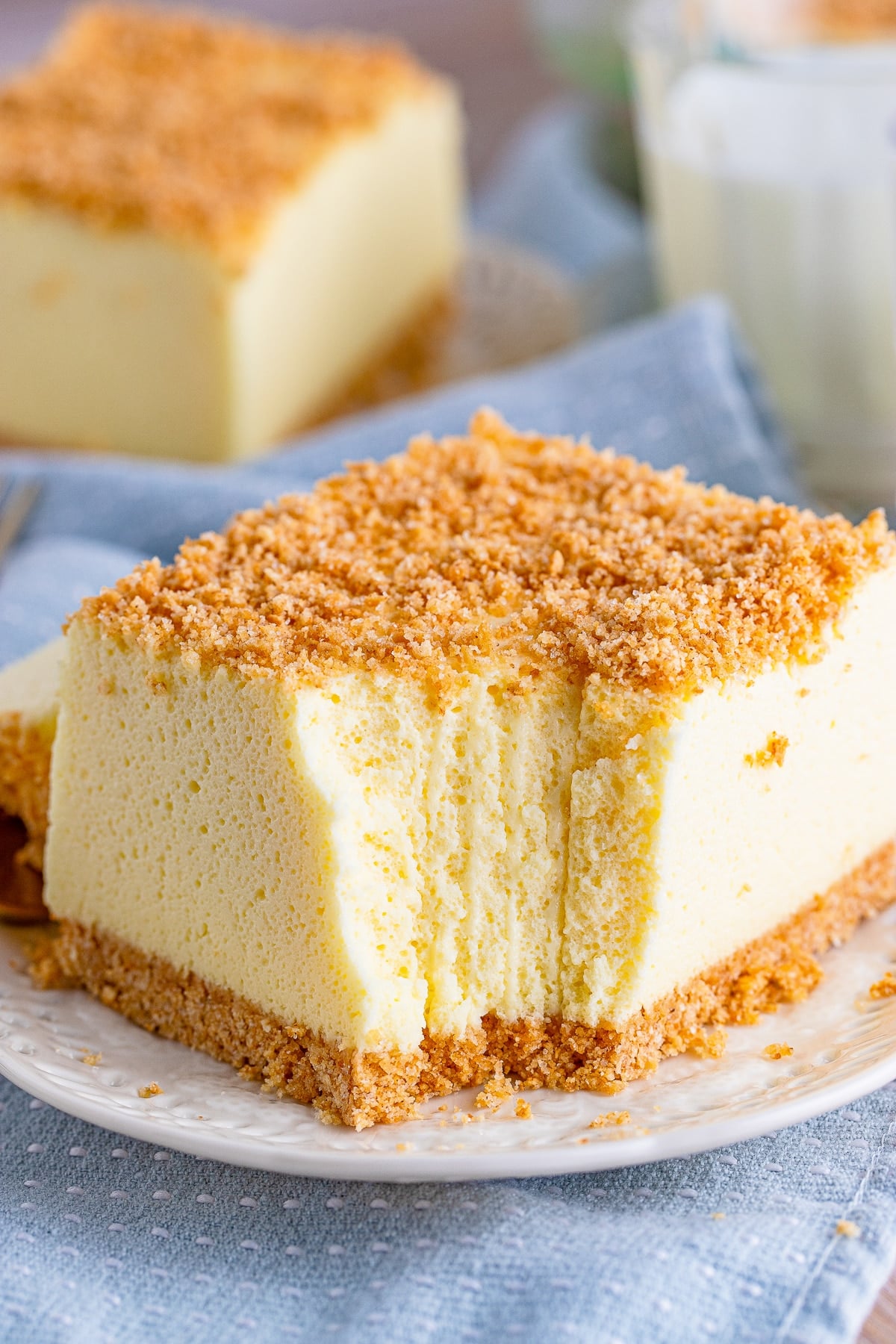 a slice of Woolworth Cake on a plate with a bite taken out