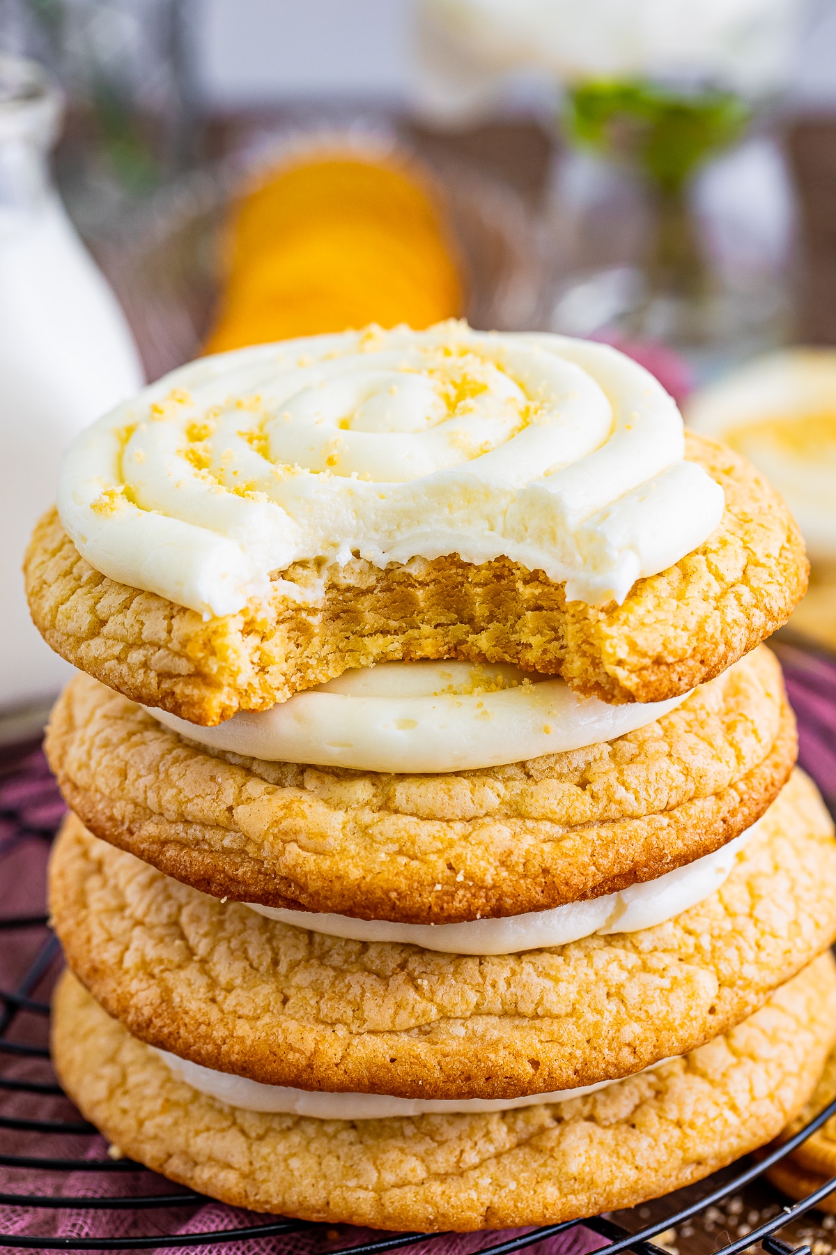 a stack of Golden Oreo Cookies with the one on top having a bite taken out
