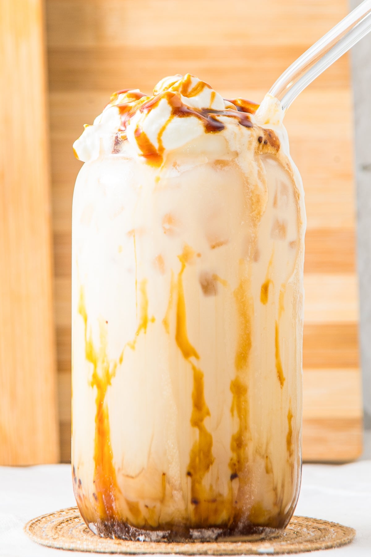 up close image of Iced Caramel Latte in a tall glass