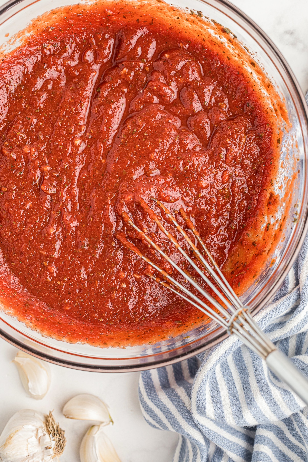 up close overhead image of Pizza Sauce in glass bowl