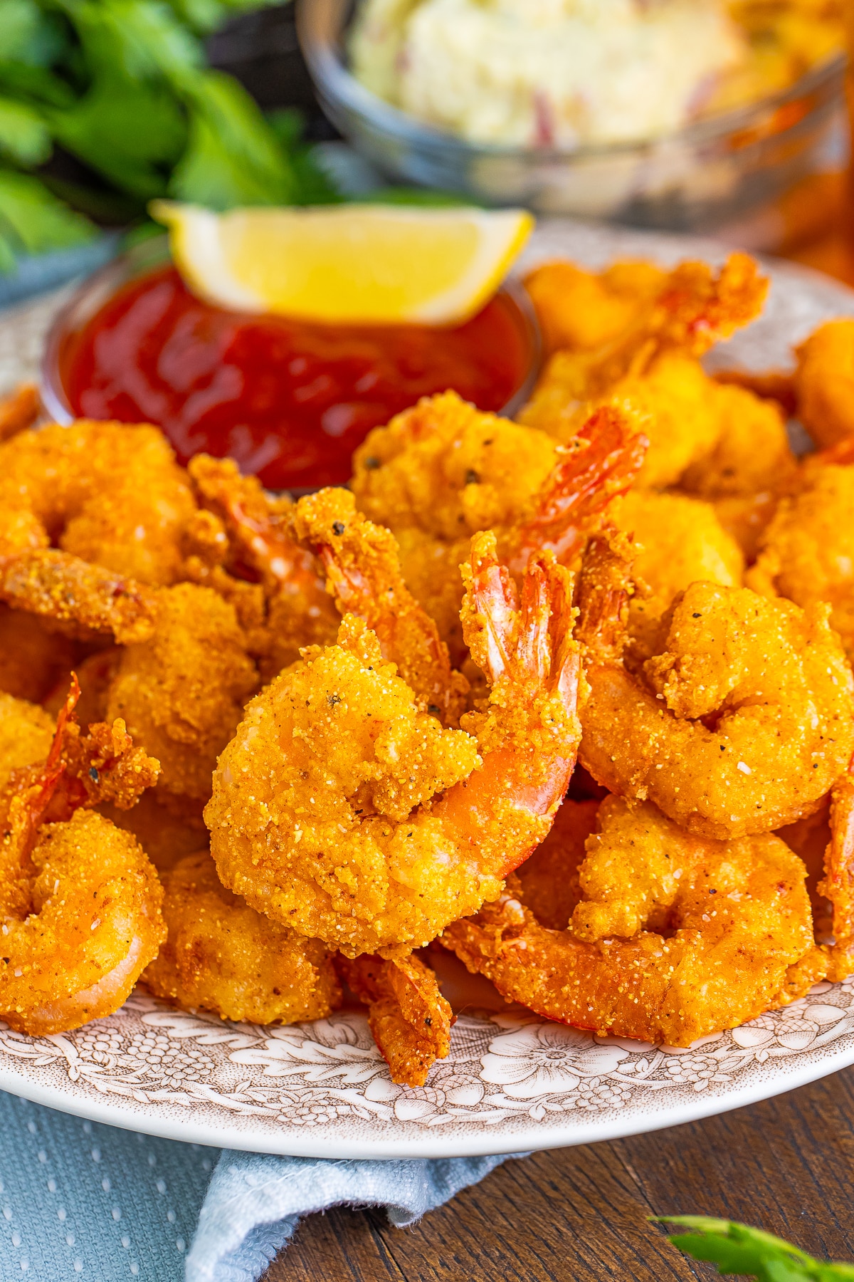 finished Fried Shrimp on a tan plate