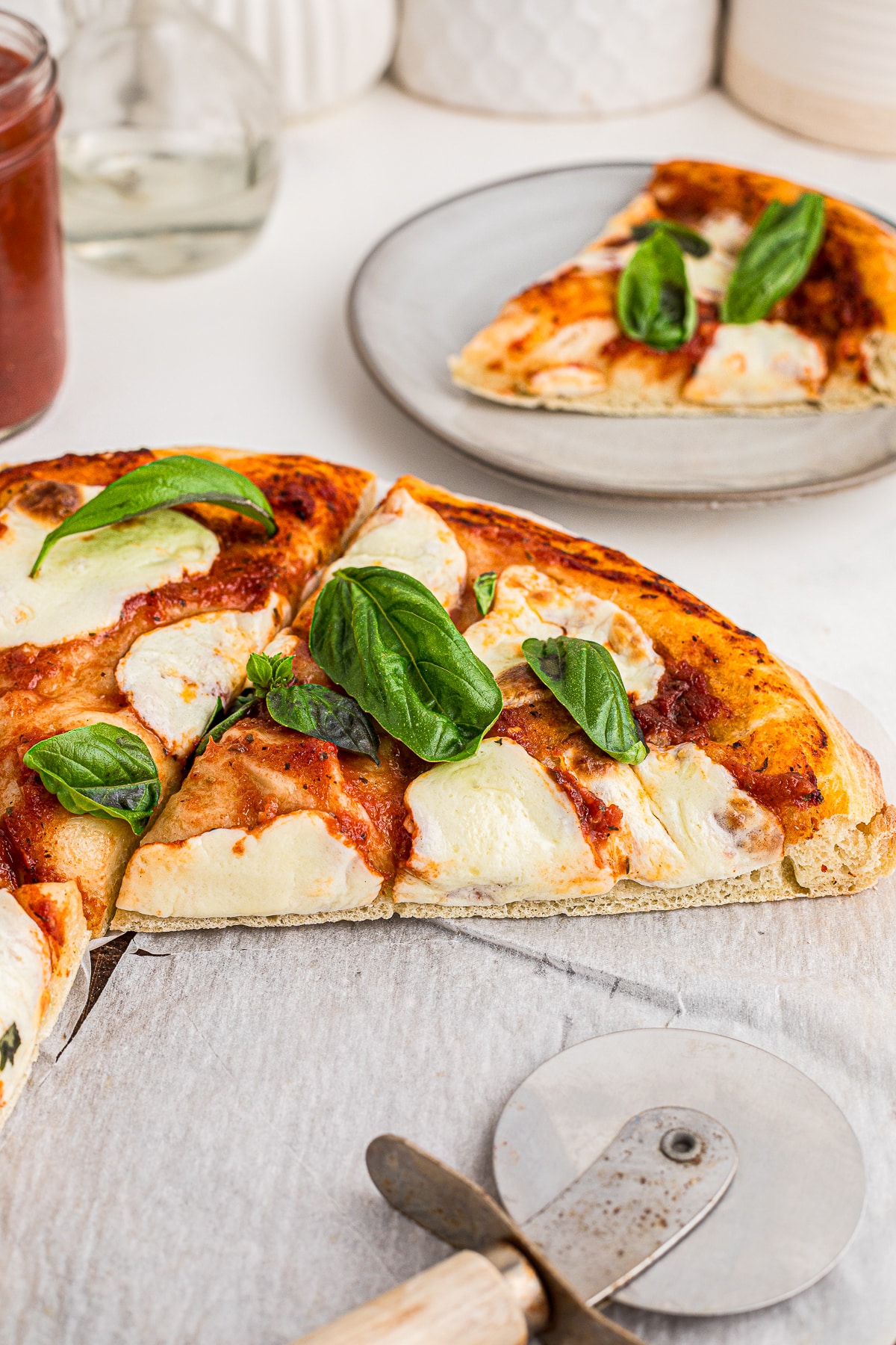 a slice of Margherita Pizza on a pizza peel